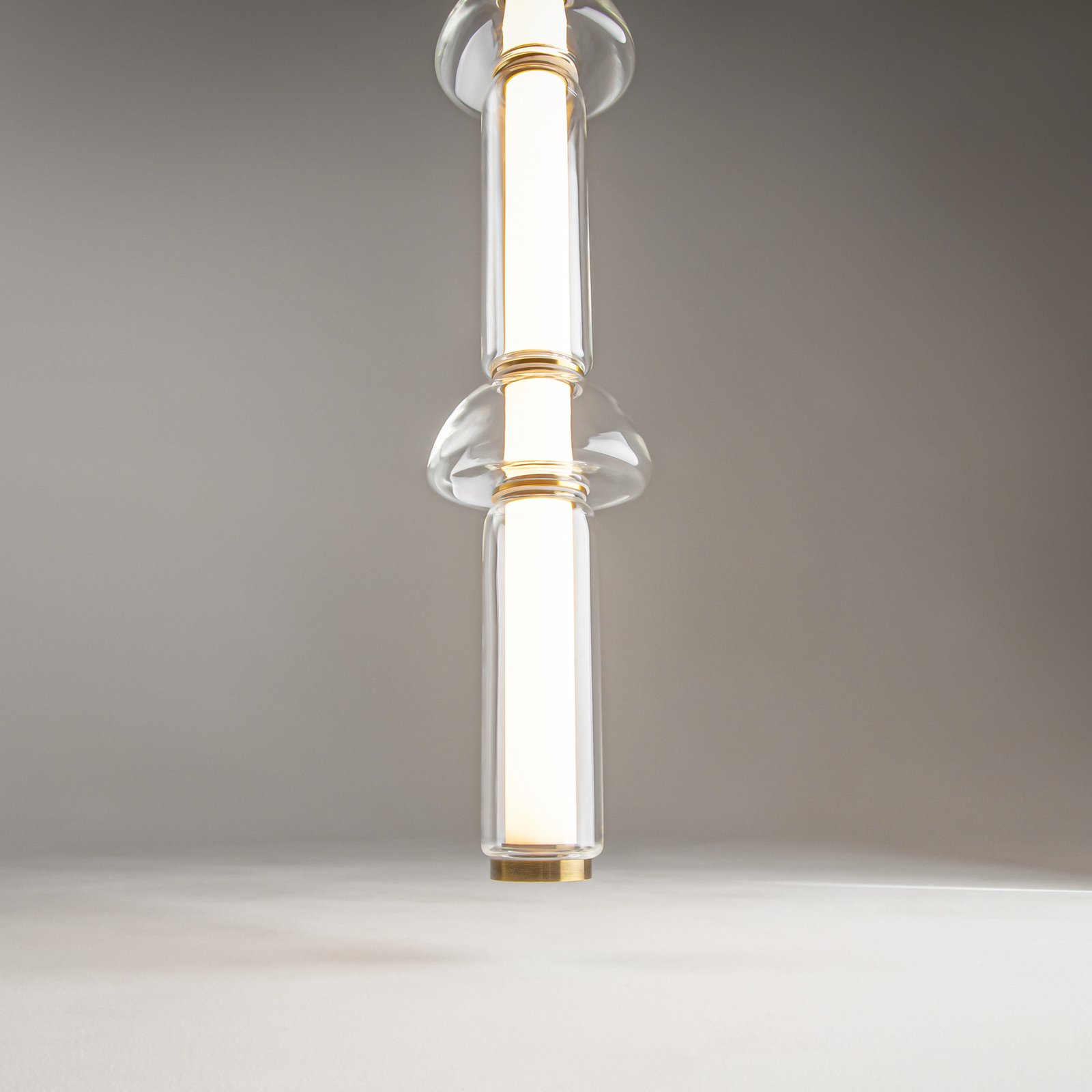 Maytoni Cosmo LED pendant light, brass, length 98 cm, glass