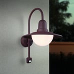 Sensor-buitenwandlamp NORMAN, roest, Ø 30 cm metaal/glas IP44