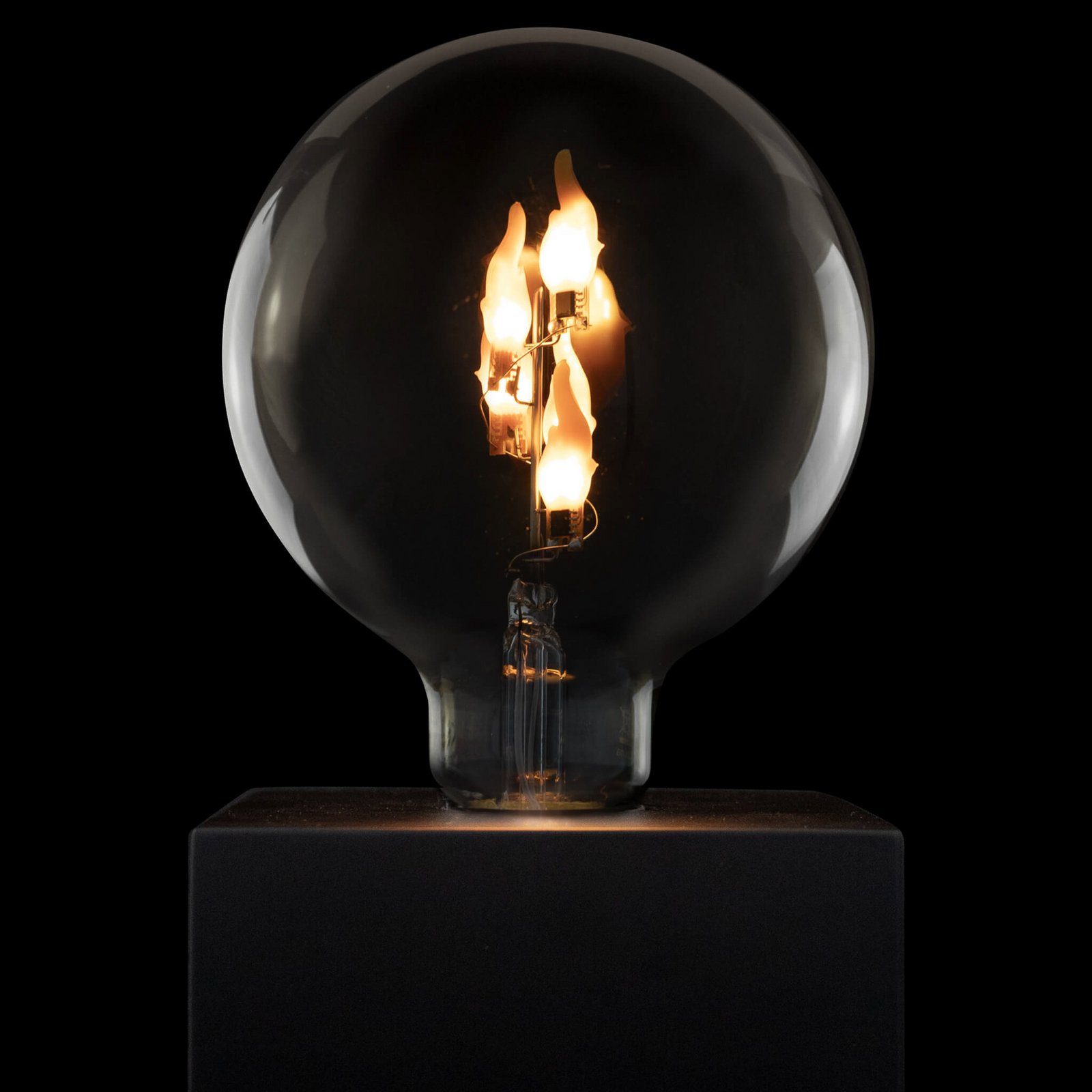 Segula LED Fire Flame Line E27 1W G125 caurspīdīga stāvoša 1800K Segula LED Fire Flame Line E27 1W G125 caurspīdīga stāvoša 1800K