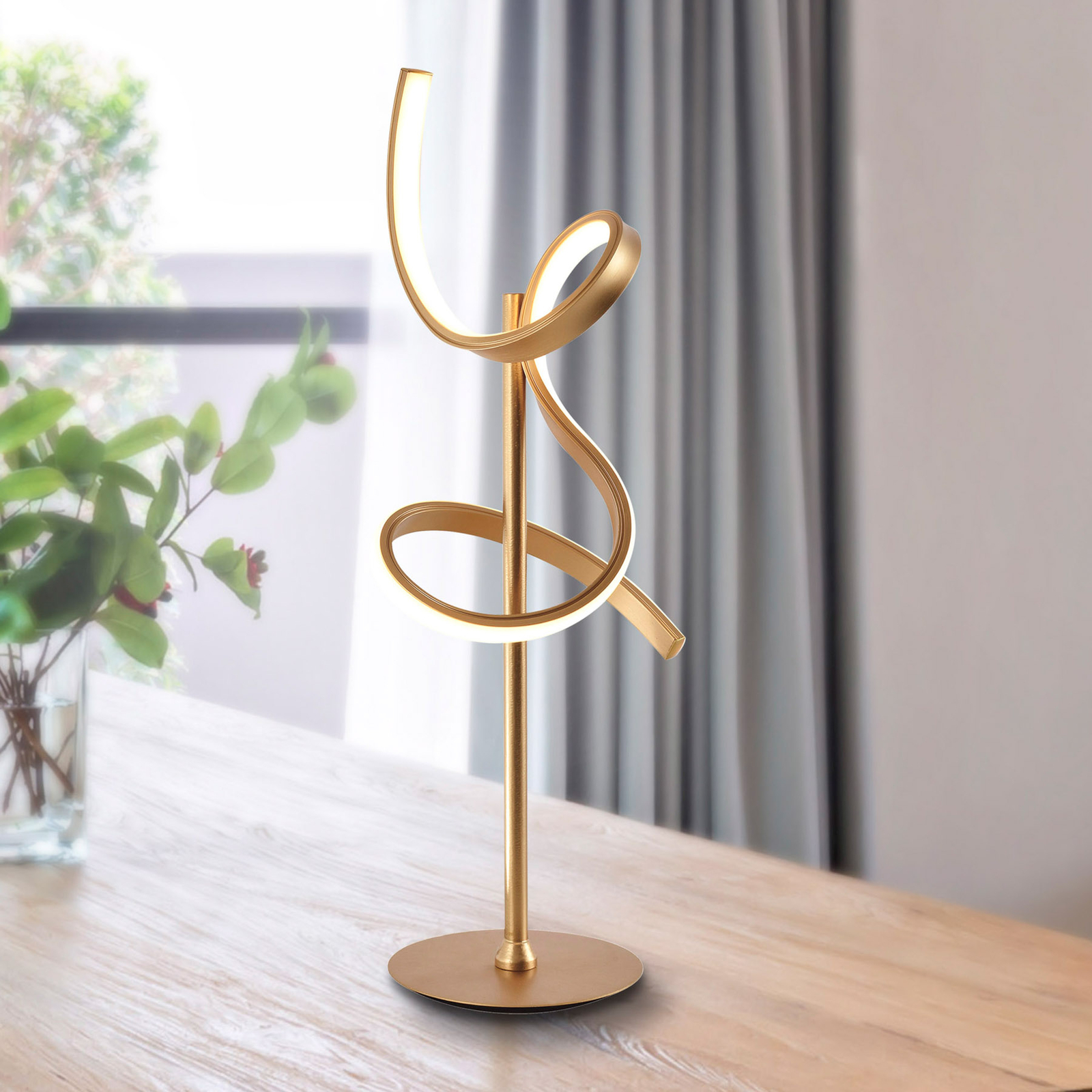 Lámpara de mesa LED Curls, latón mate