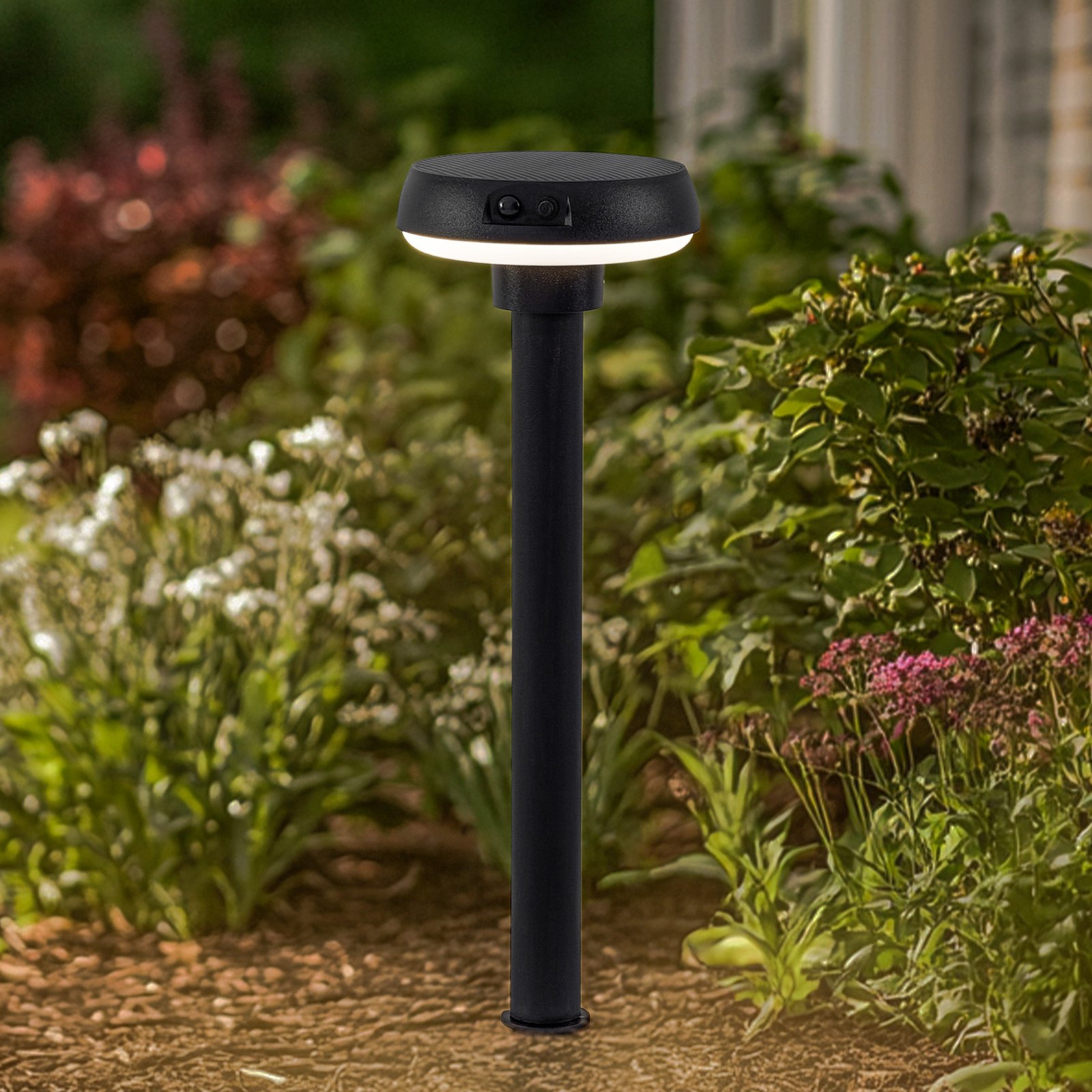 Lindby Brinca lámpara con pica LED solar, negra, PC, sensor