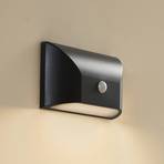 Lindby LED outdoor wall light Siana, black, PC, sensor