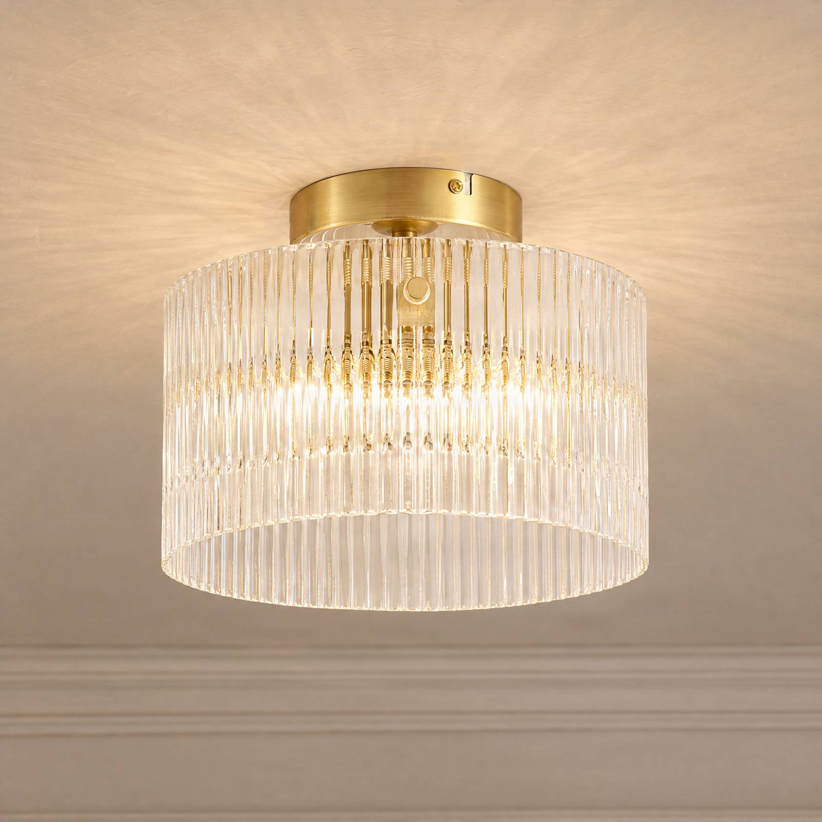 Lampa sufitowa Lucande Meritt, mosiądz/przezroczysta, Ø 25 cm, szkło