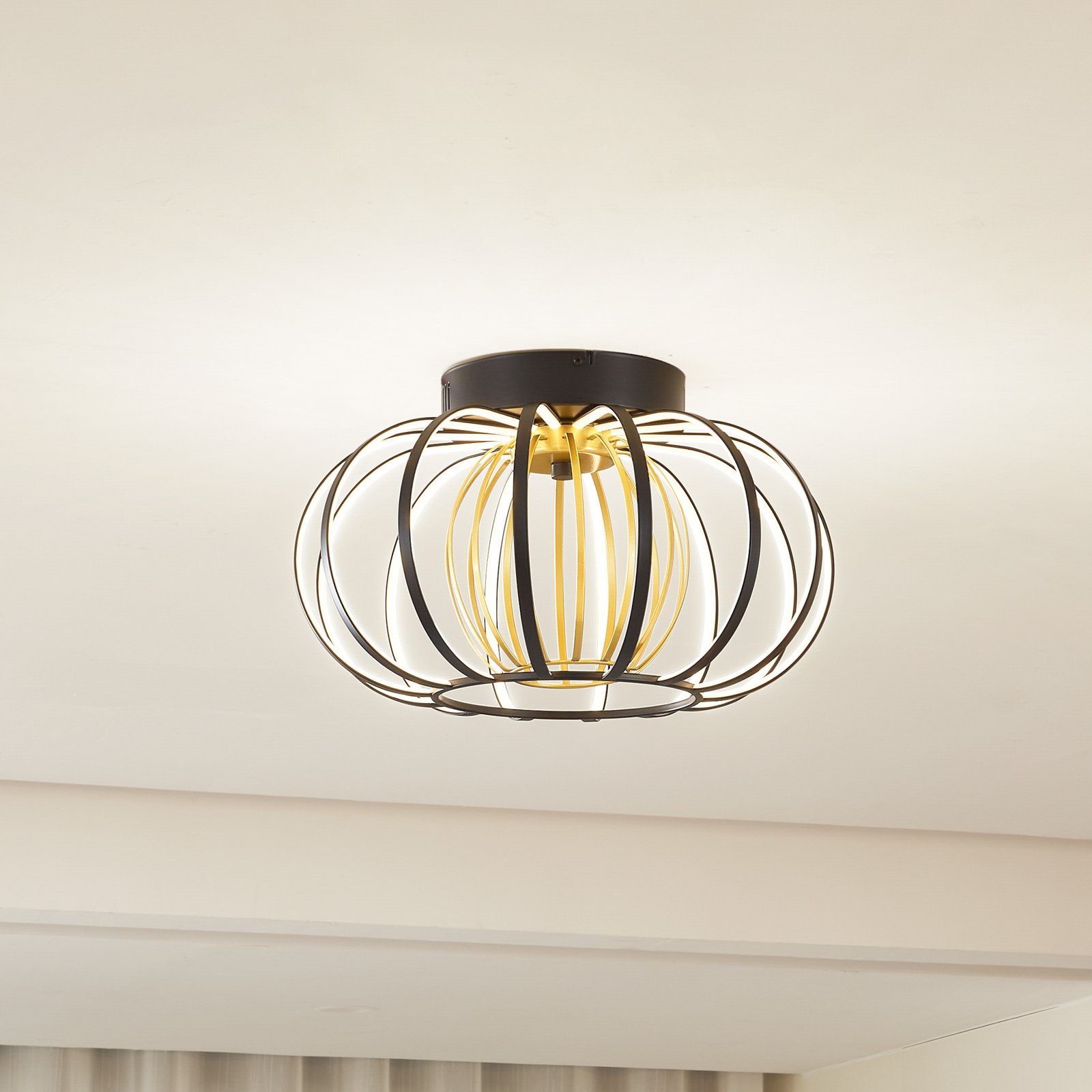 Lucande LED ceiling light Birger, height 24 cm, black/gold