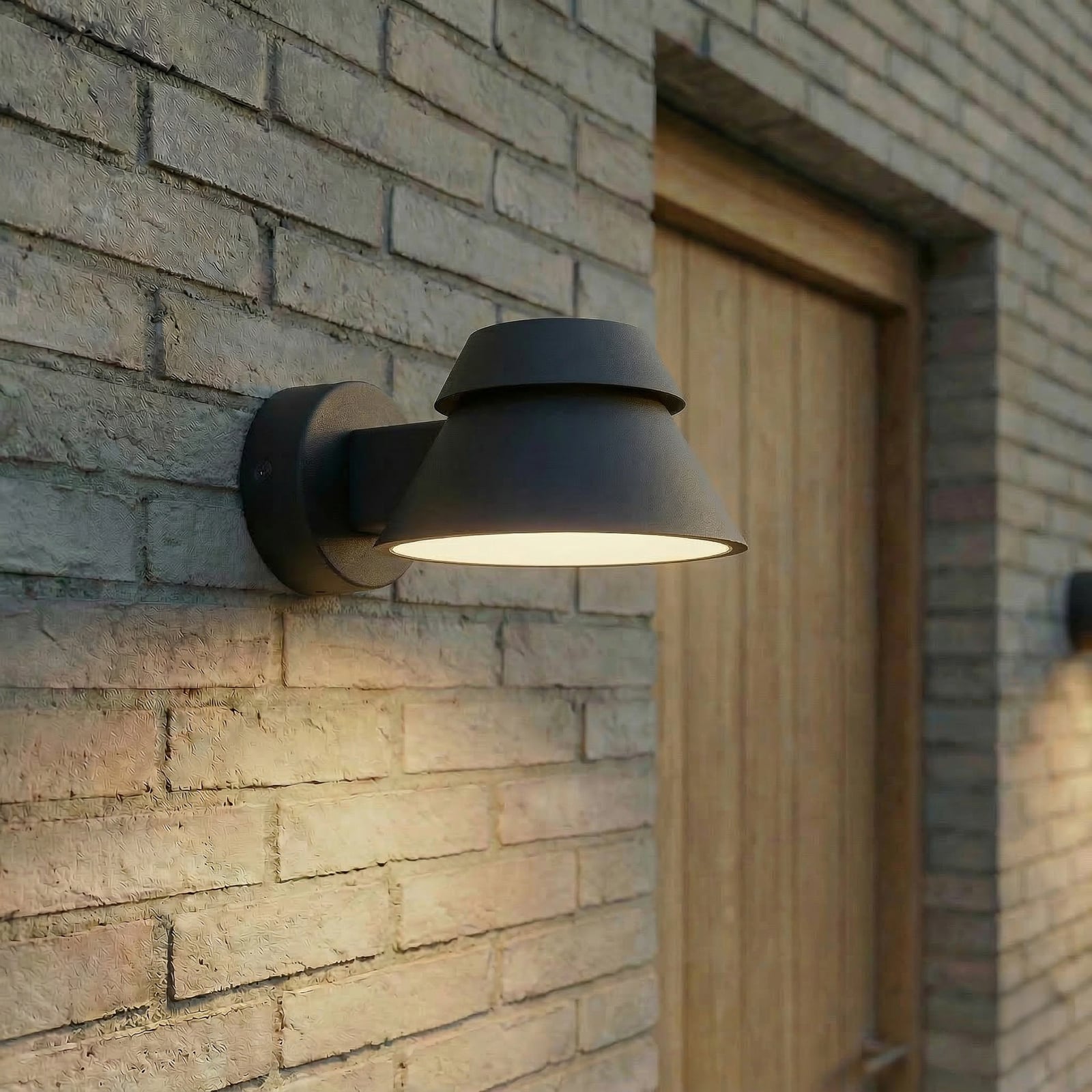 Moena LED-utomhusvägglampa, IP44, aluminium, glas, svart – Lucande