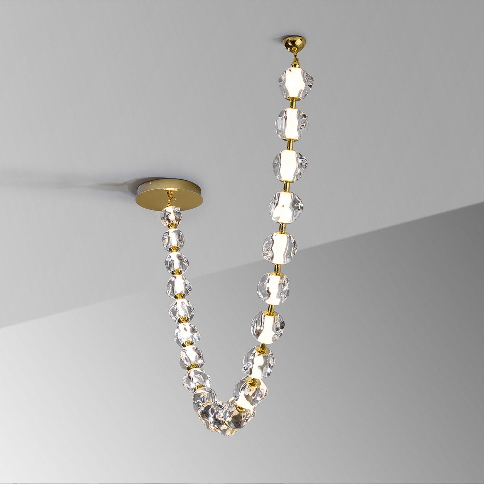 Zaria LED pendant light, 21-fl., gold, clear, metal, acrylic