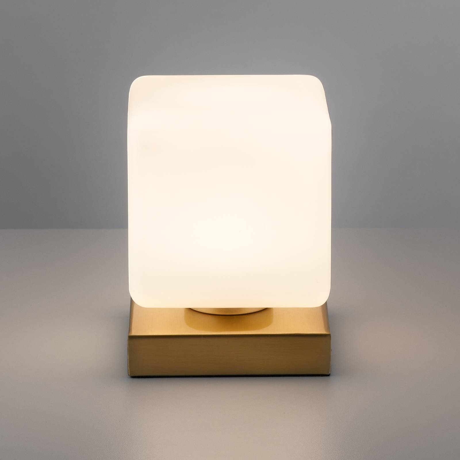Paul Neuhaus lampa stołowa LED Dadoa, mosiądz, szkło, ściemniana