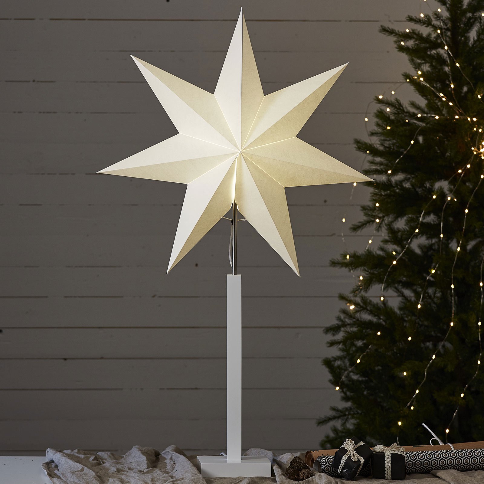 Standing star Karo with wooden base