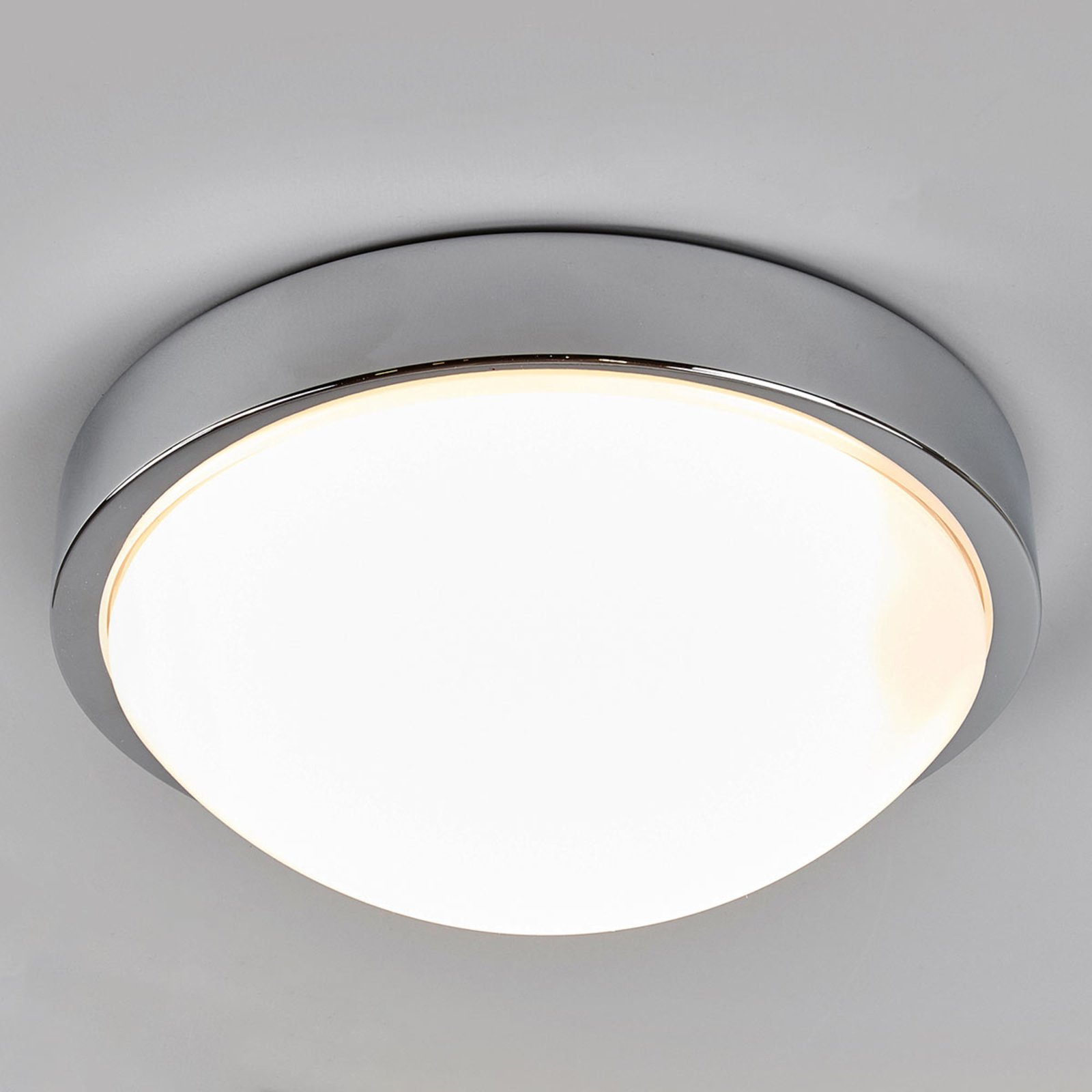 Lindby Chrome-plated bathroom ceiling lamp Elucio, IP44, for Bathroom, polycarbonate, metal, E27, 18 W, energy efficiency: A++, H: 10.5 cm