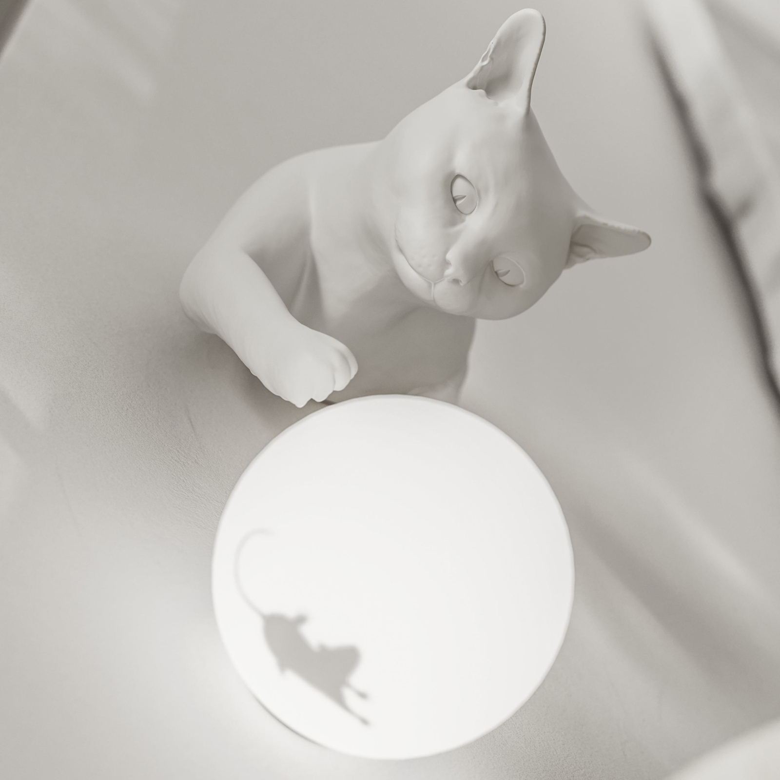 Karman Maoo wall light, white ceramic, glass, cat figurine