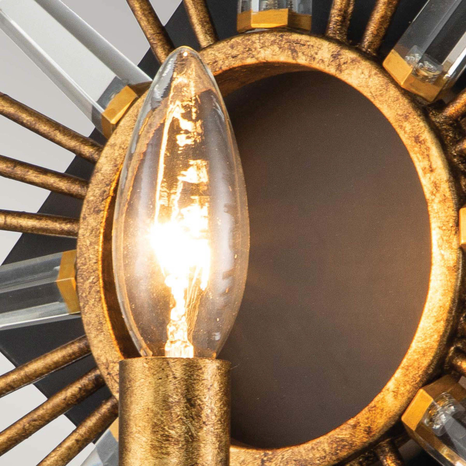 Stenska svetilka Sun King, zaključek iz zlate folije 