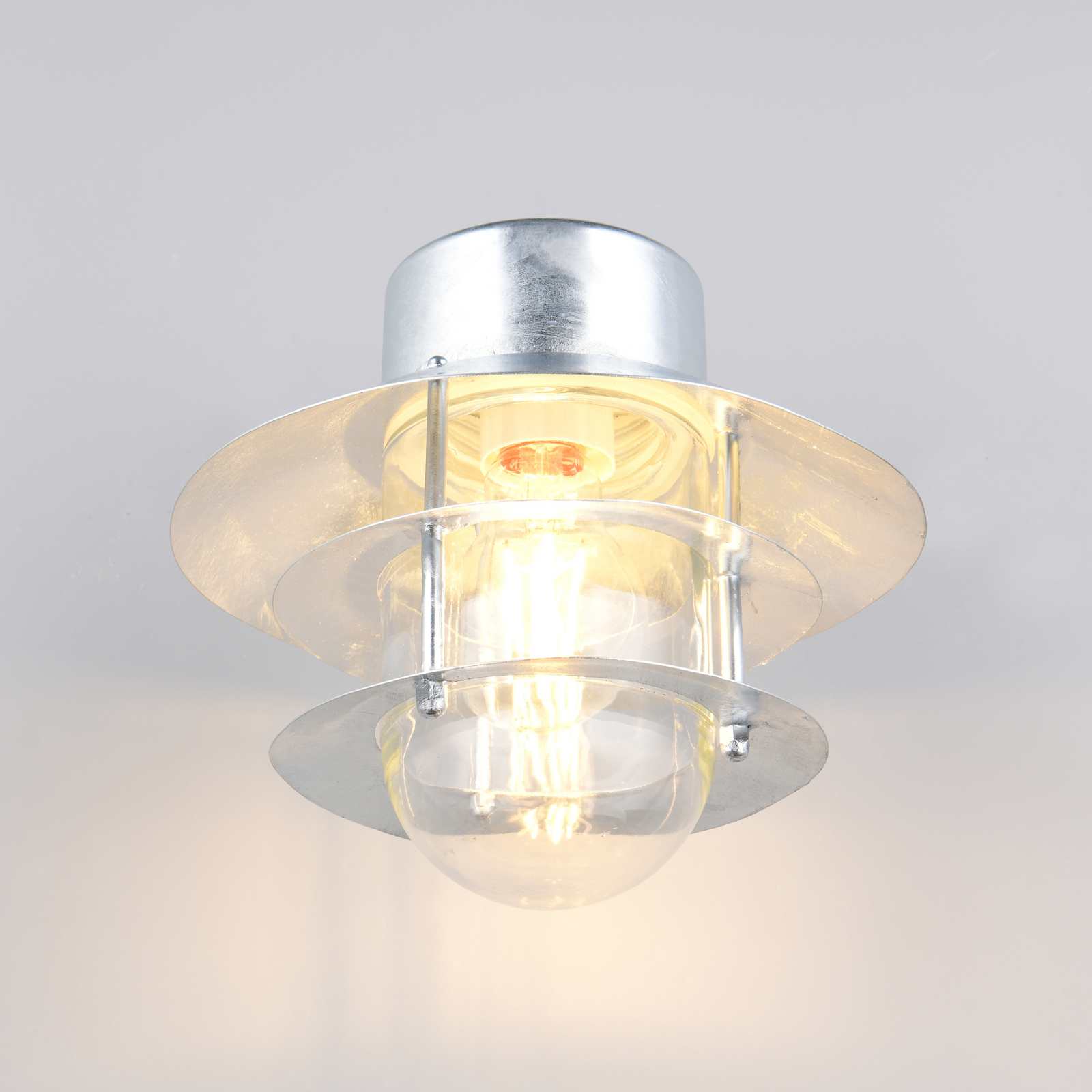 Vonkajšie nástenné svietidlo Ruvuuma v zinkovej farbe Ø 22 cm smerujúce nadol