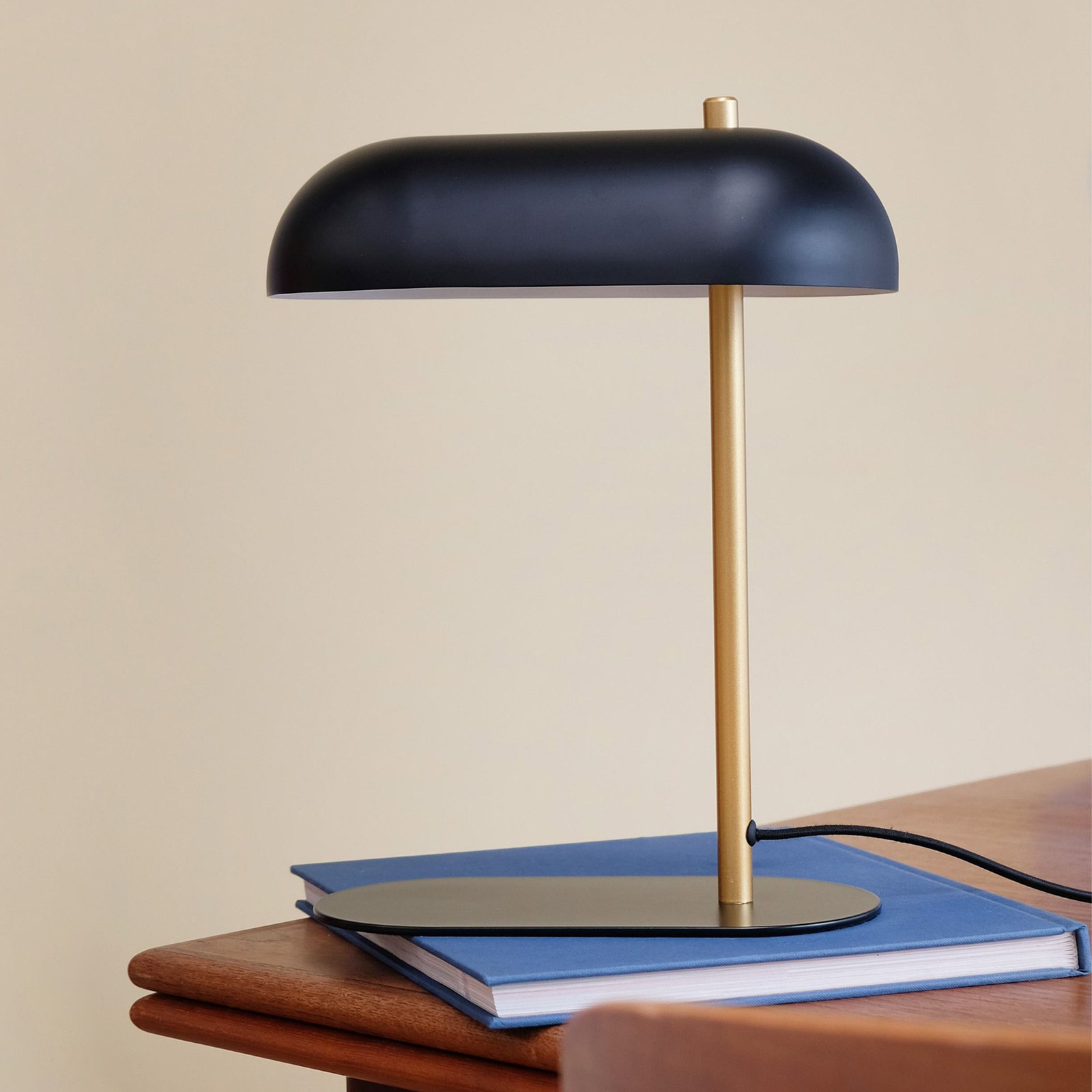 Dyberg Larsen Arch table lamp, black/brass-coloured, metal