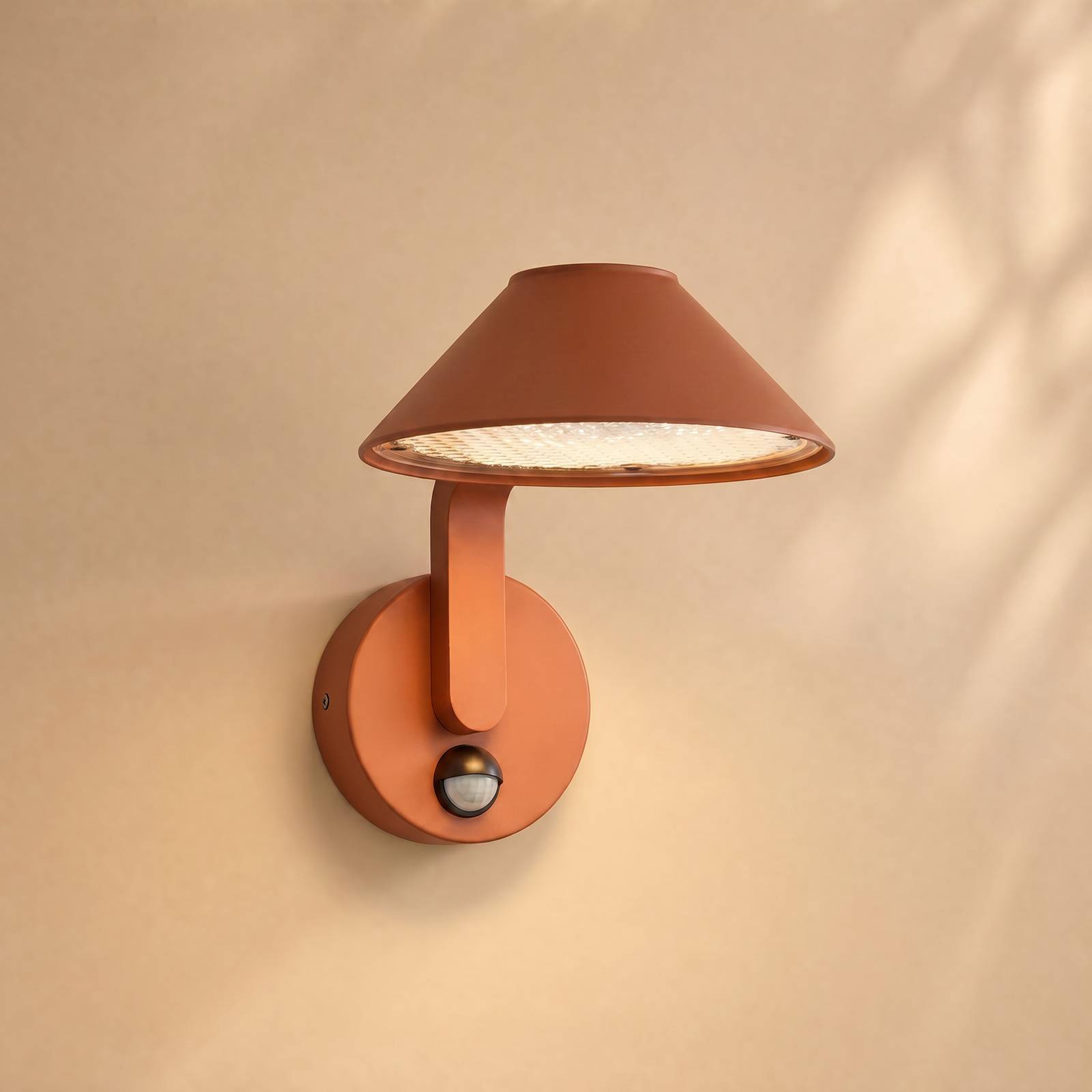Kinkiet zewnętrzny LED Lindby Capelo, kolor terakoty, Ø 20 cm, czujnik