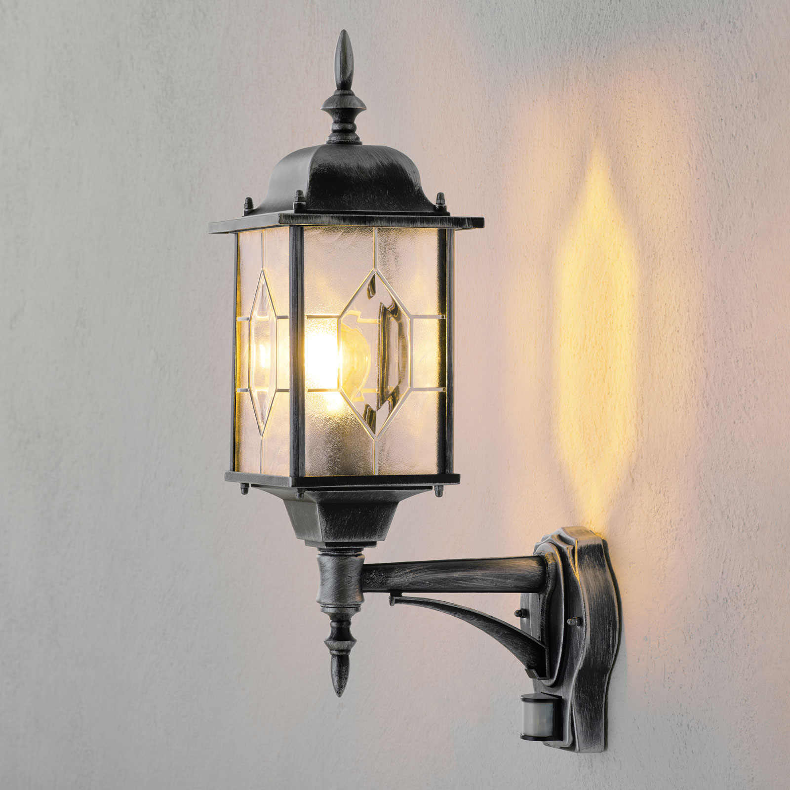 Konstmide Milano outdoor wall light with a motion detector, metal, acrylic glass, E27, 75 W, energy efficiency: A++, W: 16 cm, H: 53 cm