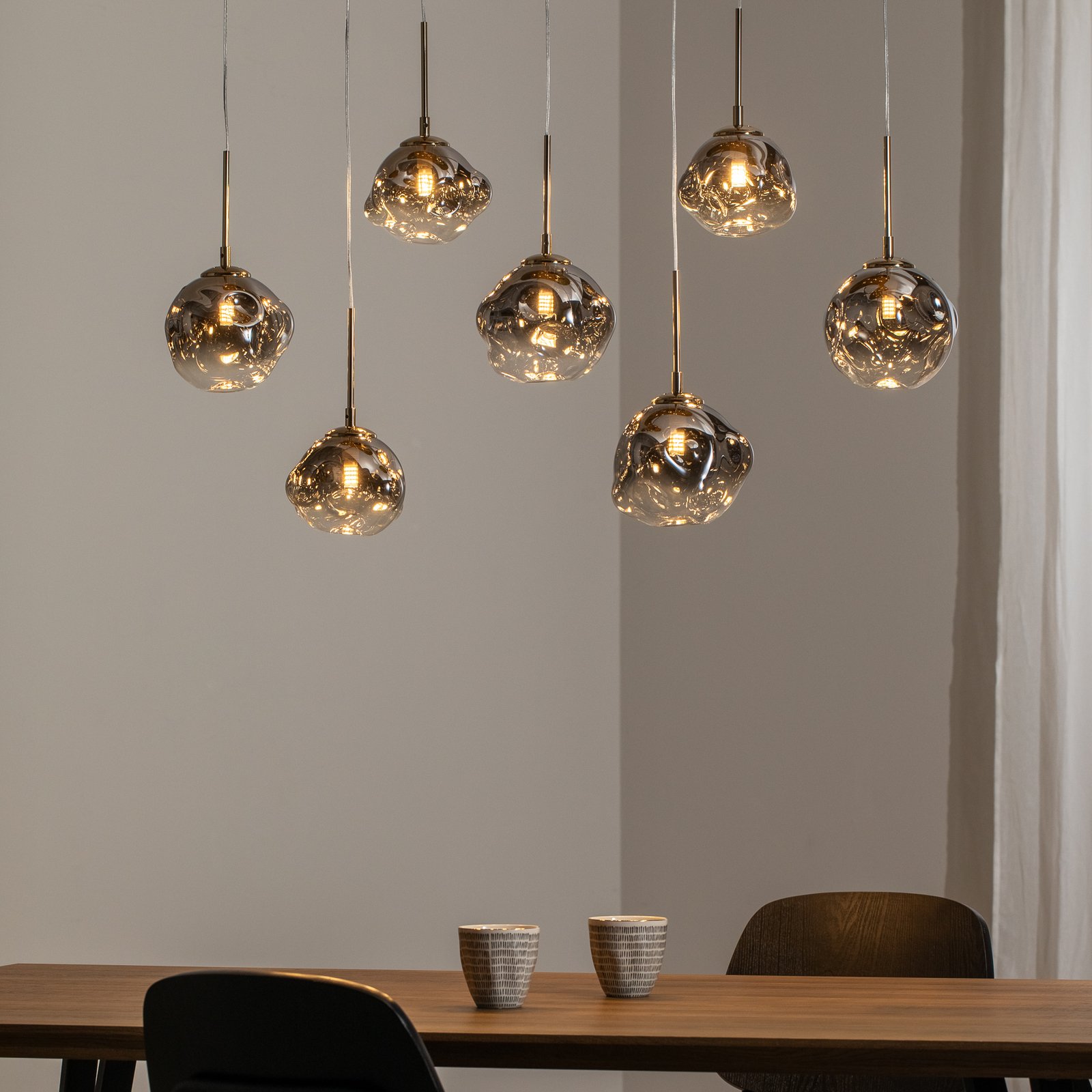 Herman pendant light, 7-bulb, gold-coloured, length 97 cm, glass