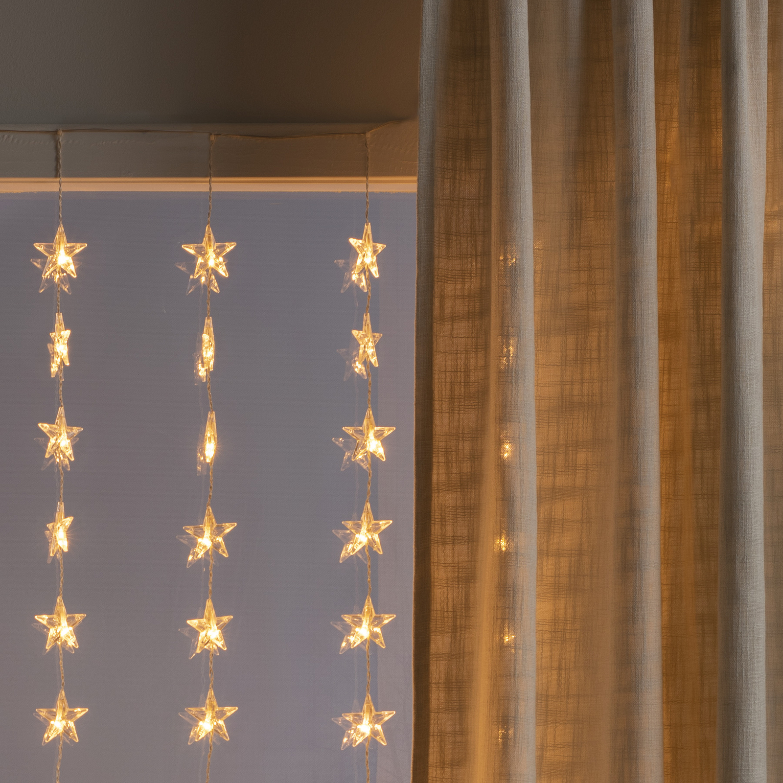 En detalle Mira plato Cortina de luces LED estrellas 120 luces, ámbar | Lampara.es
