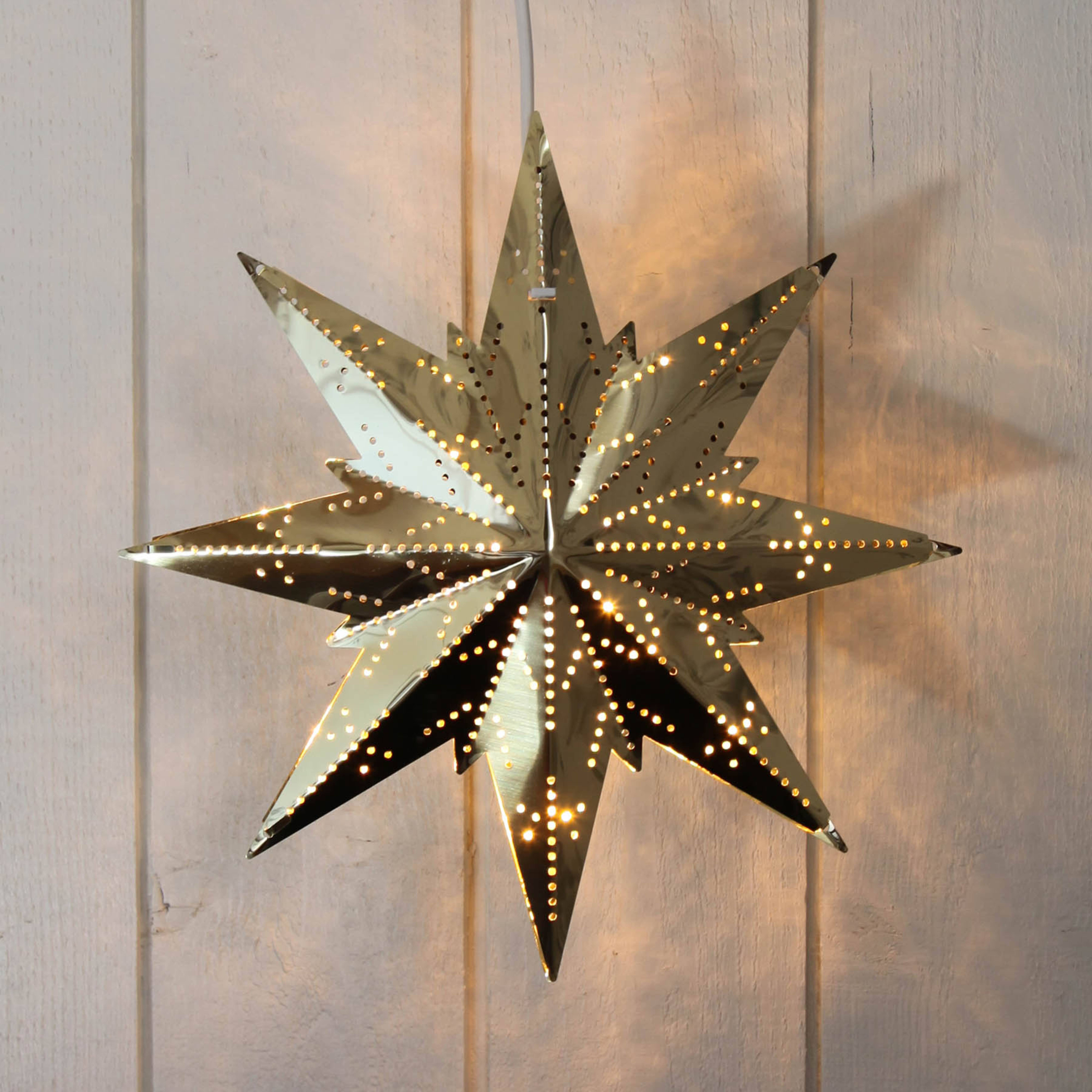 Estrela mini em metal dourado
