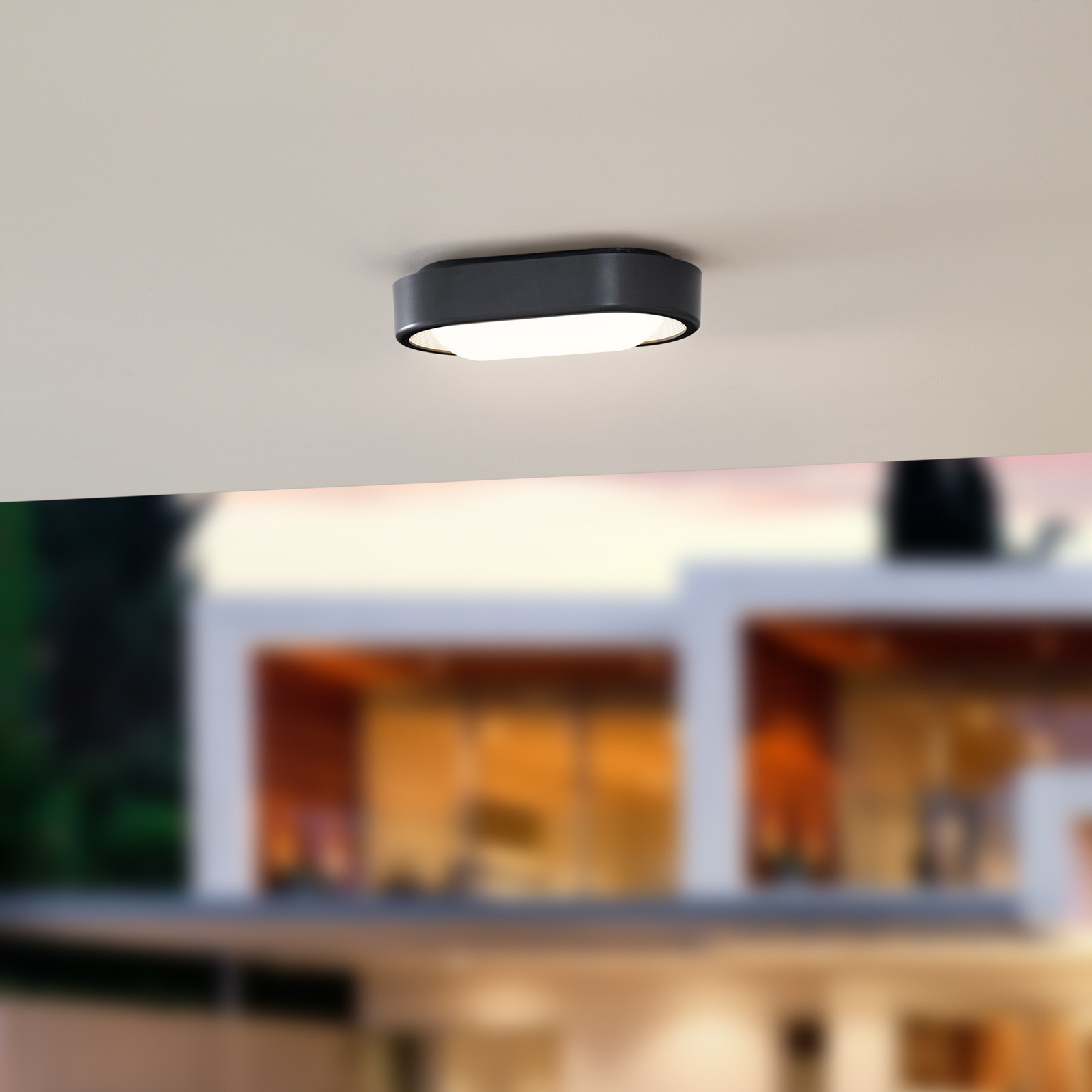 Lindby LED-Außenwandleuchte Niniel, schwarz/weiß, oval