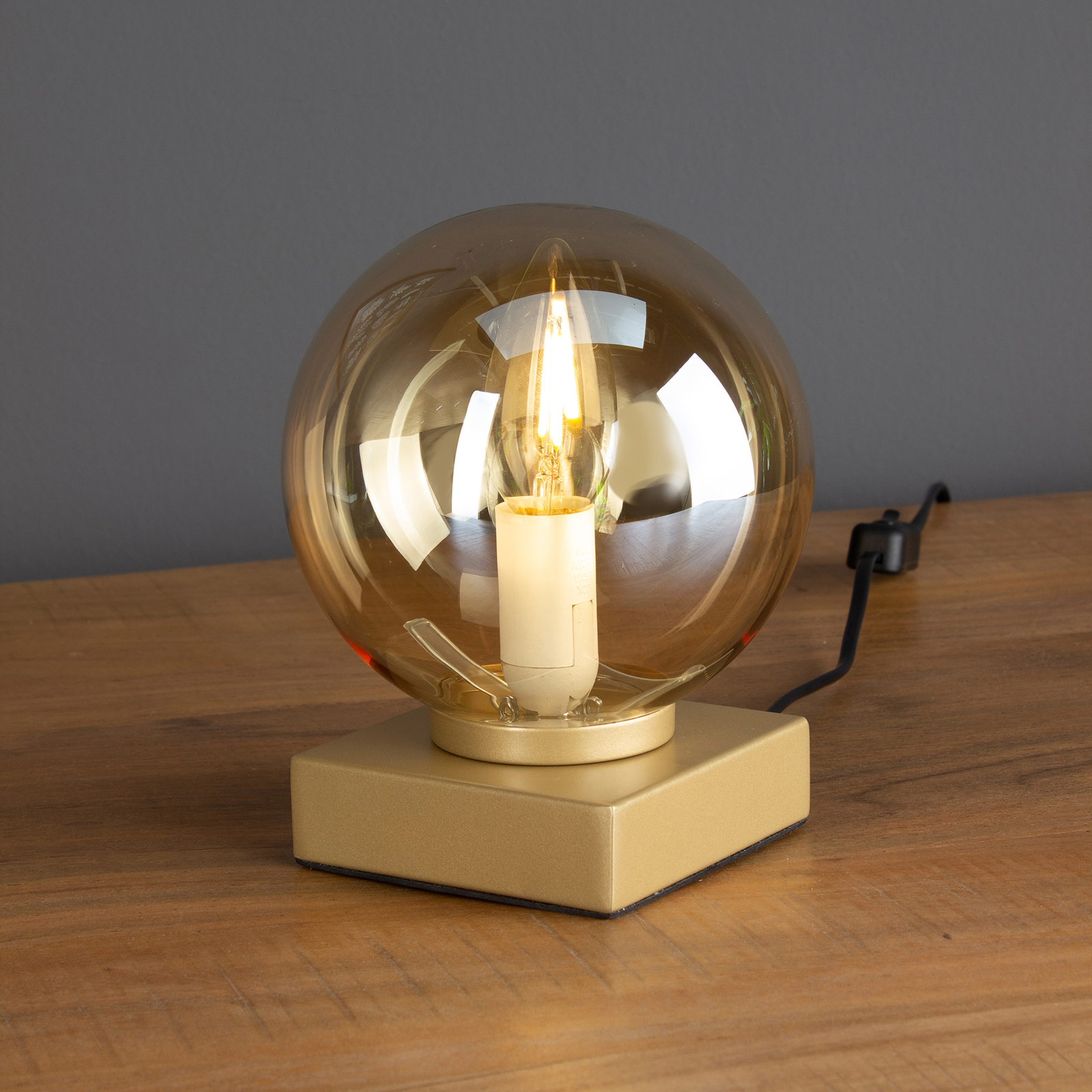 Lampa stołowa Pluto złota ze szklaną kulą szampan