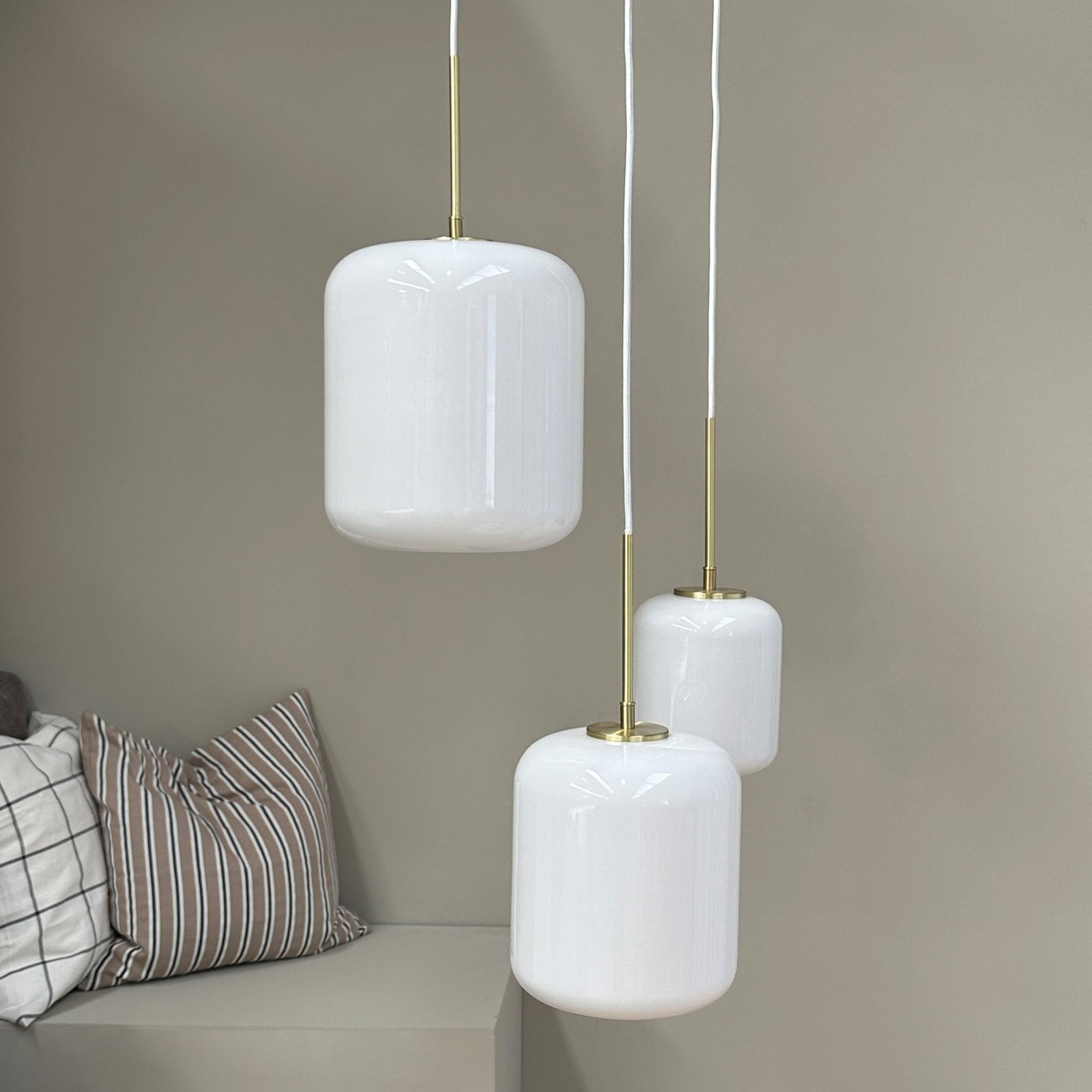 Dyberg Larsen hanging light Silvia, Ø 25 cm, opal/brass, glass