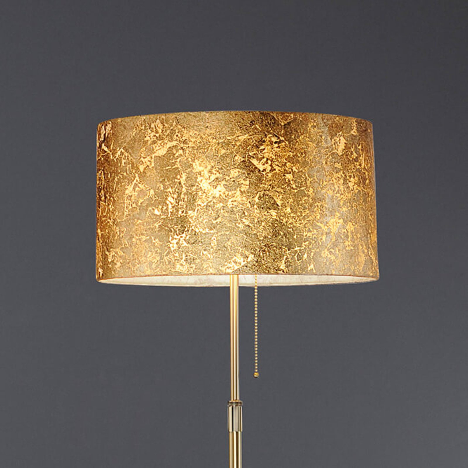 Elegant floor lamp Loop Gea with gold leaf coating