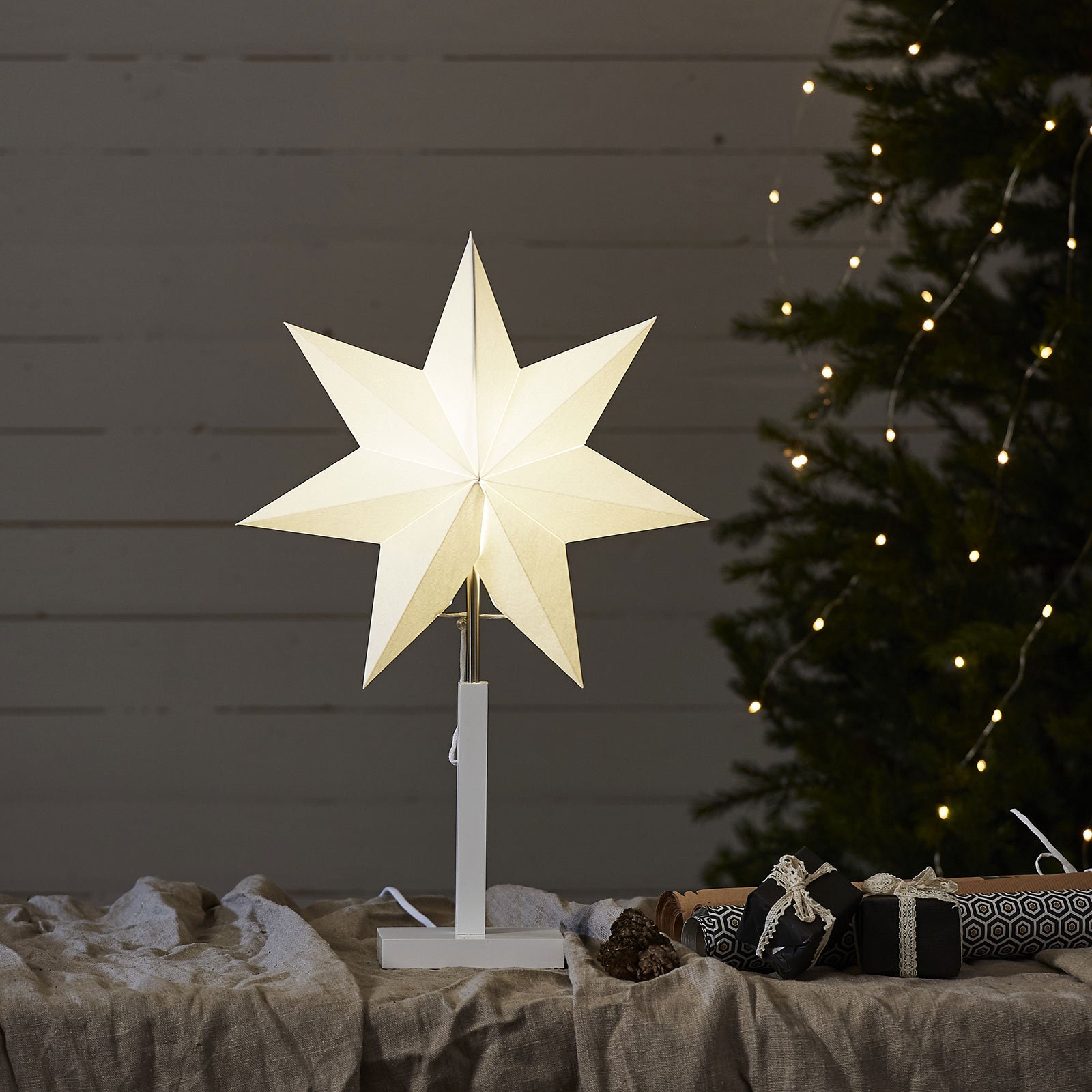 Standing star Karo with wooden base