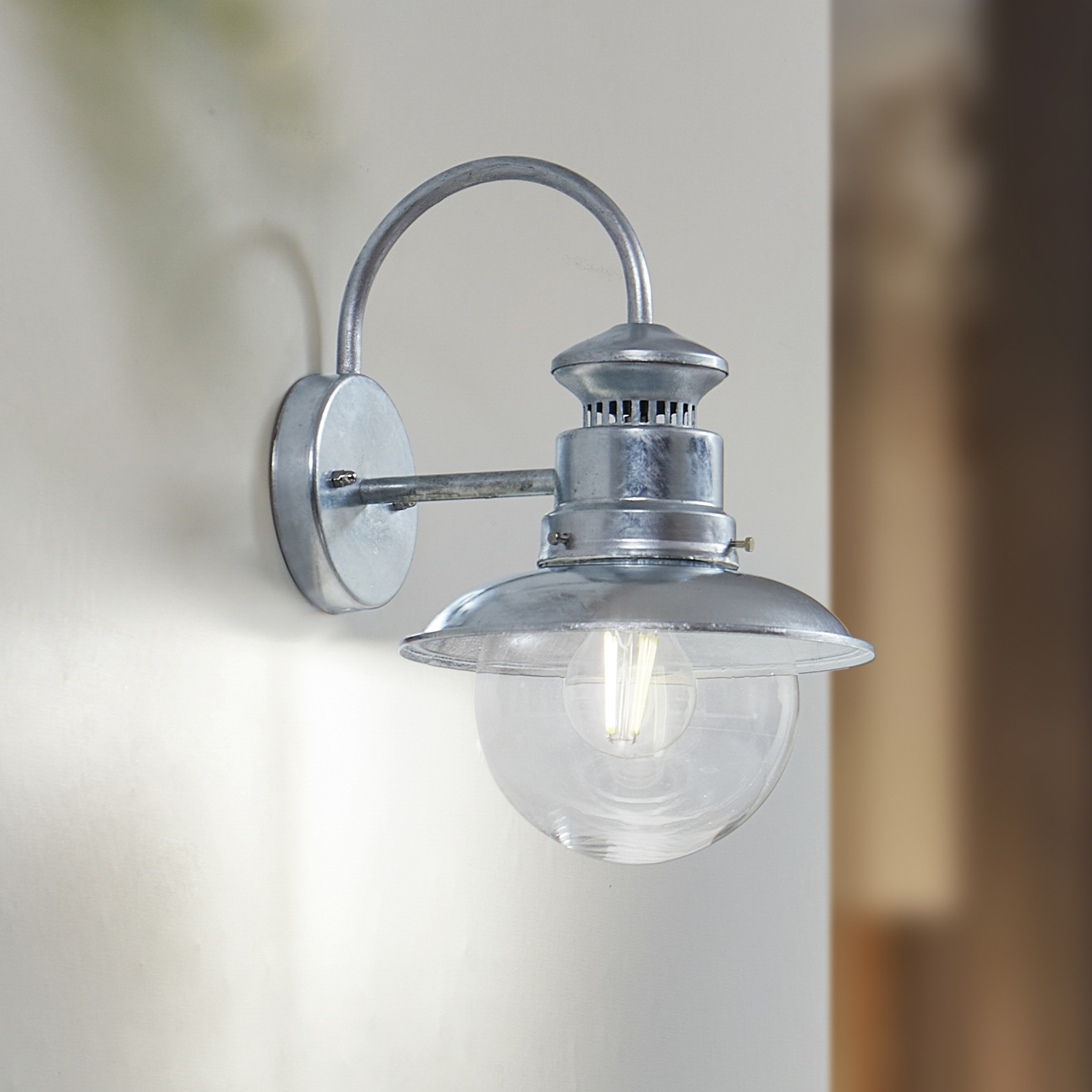 Lindby buitenwandlamp Celinor, zilver, staal, Ø 15 cm