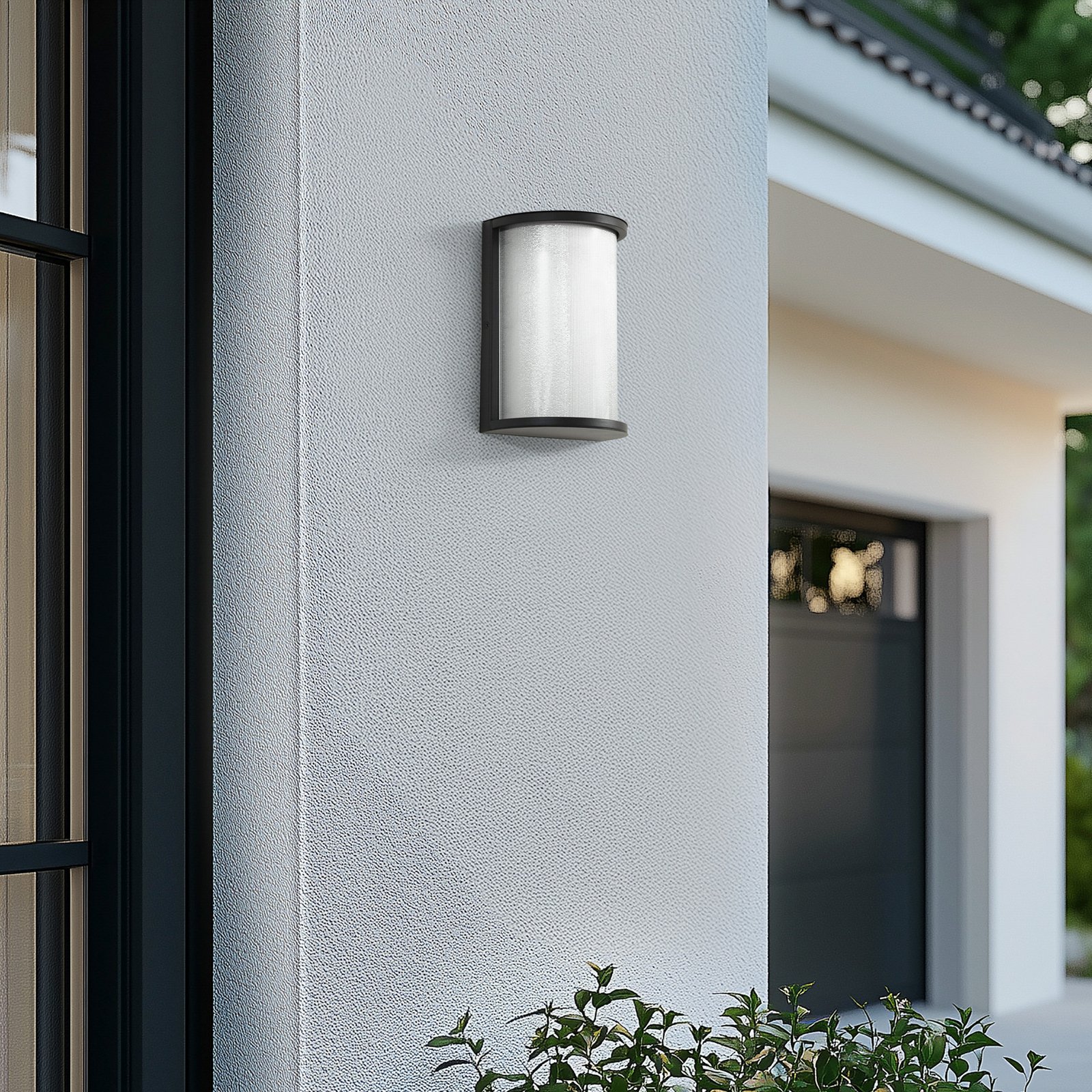 Lindby Calvik LED outdoor wall light, black, ribbed, IP44
