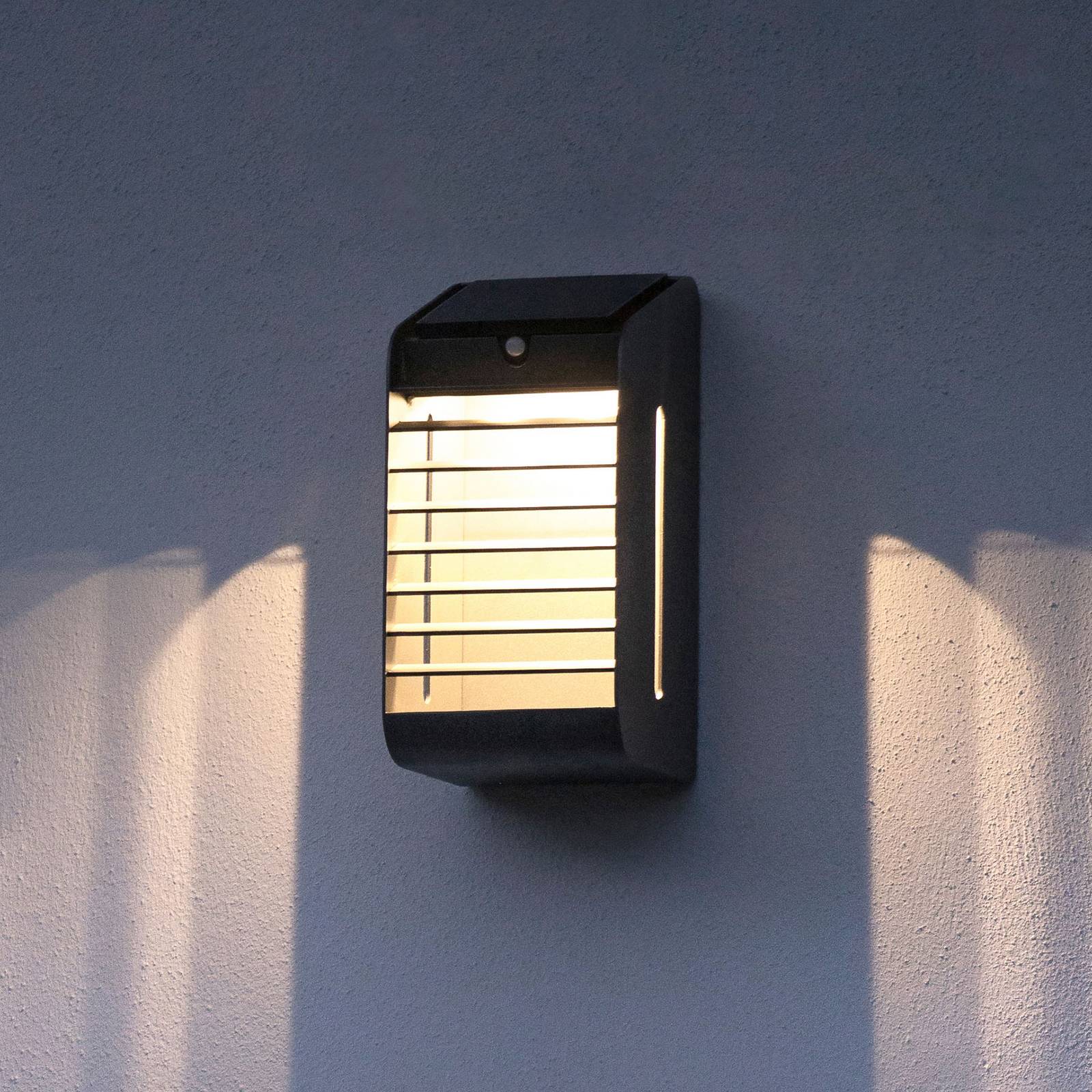 Corner LED solar wall light with sensor, grey Lights.co.uk