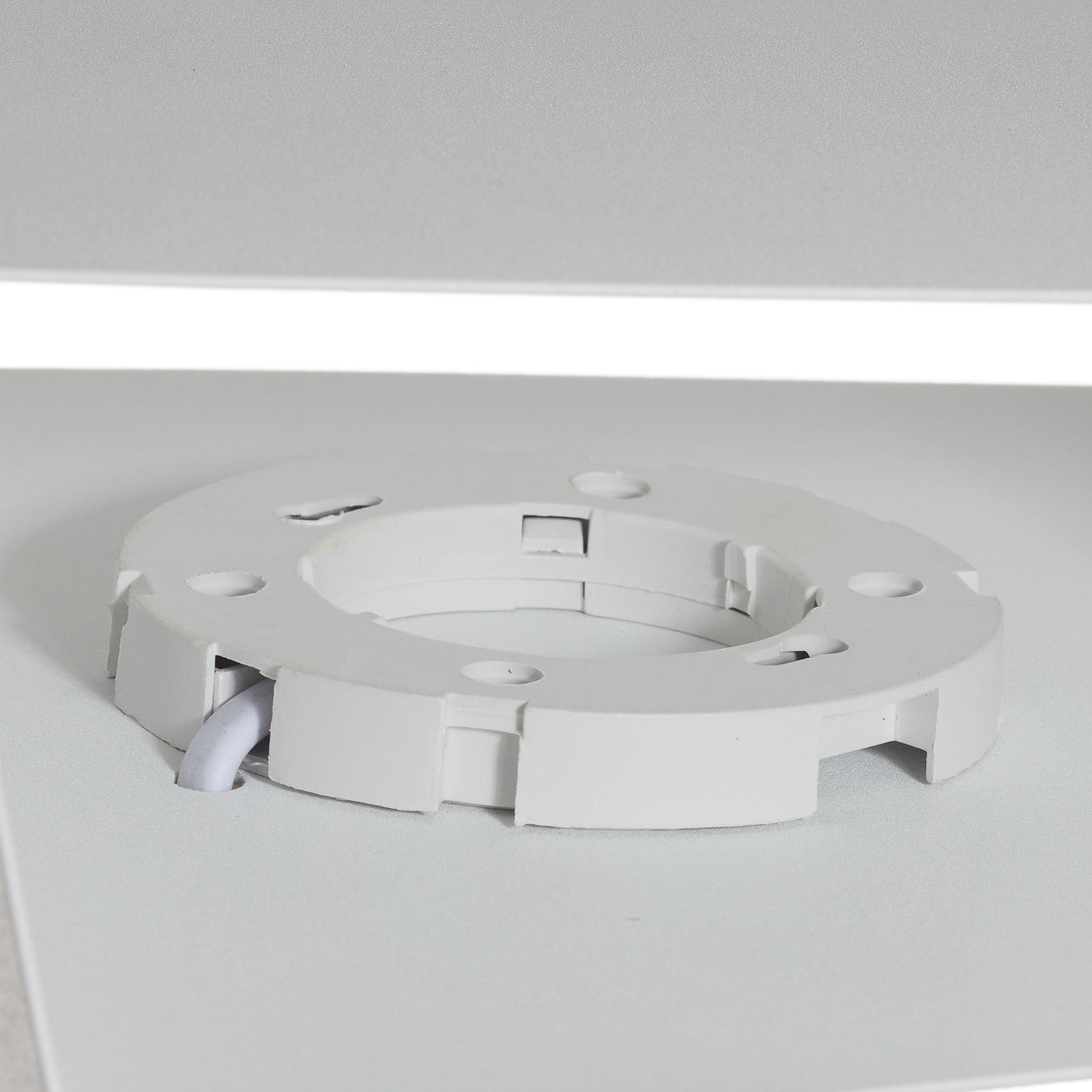 Asimetric wall light made of steel