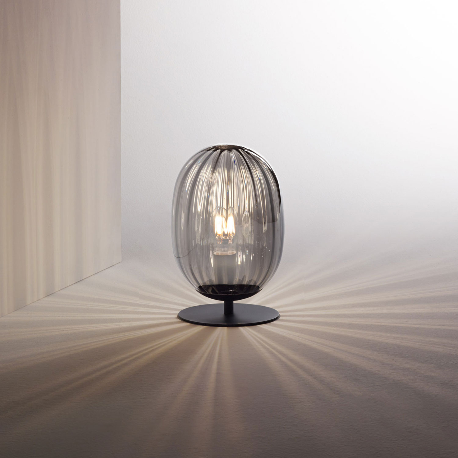 Infinity table lamp with a curved glass lampshade