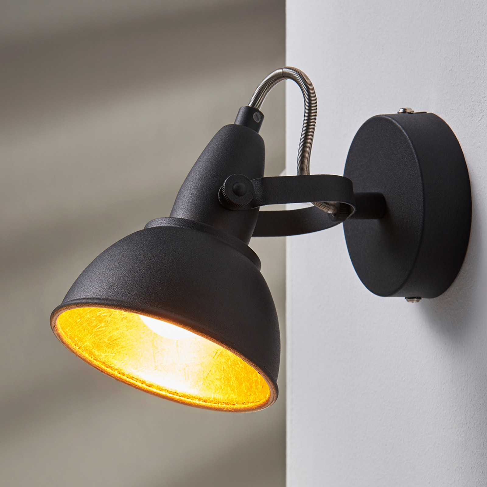 Black and gold wall light Julin Lights.co.uk