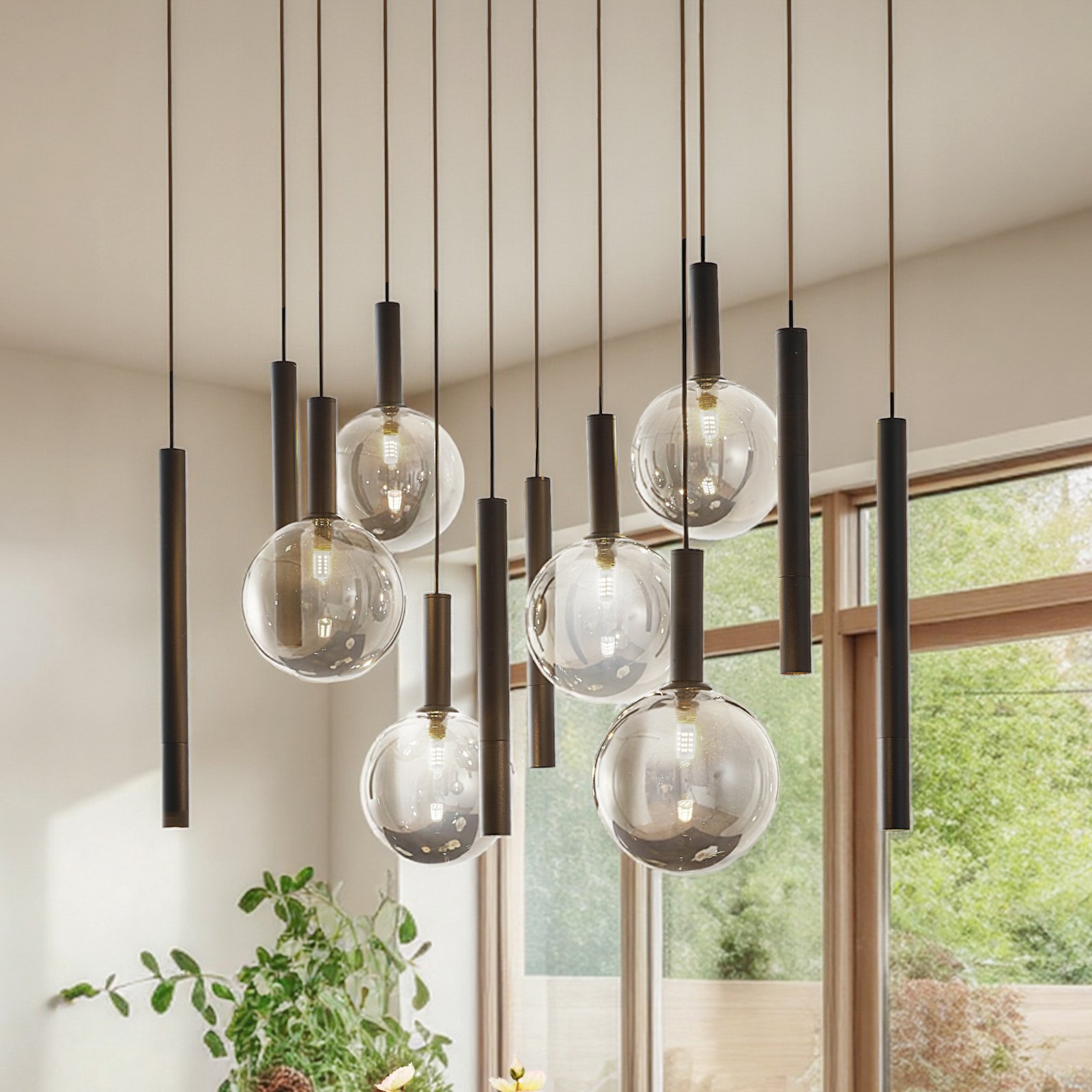 Lucande Lampada a sospensione Lumavia, a 12 luci, vetro, nero/trasparente, G9