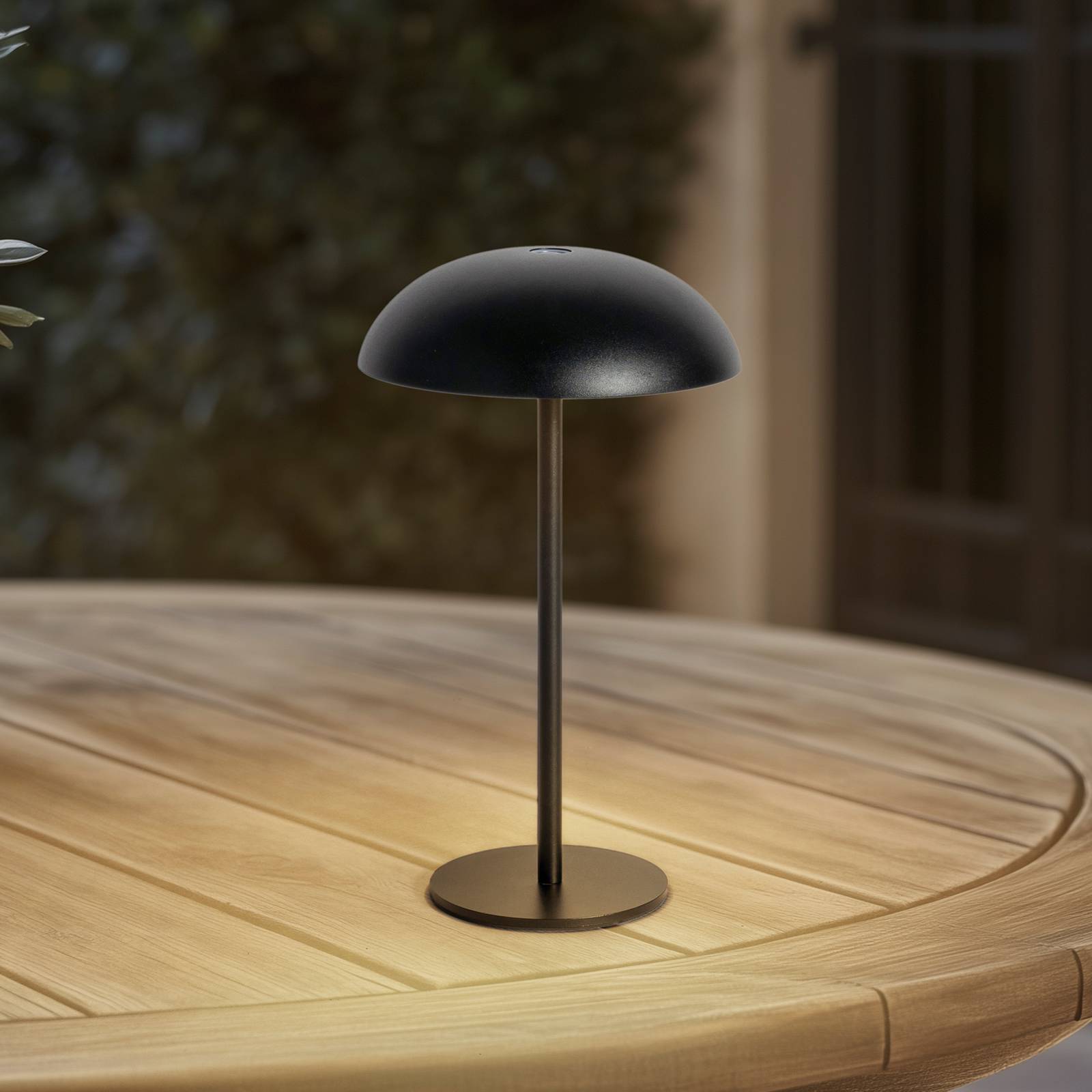 Arcchio LED ładowalna lampa stołowa Thenra, czarna, uchwyt ścienny