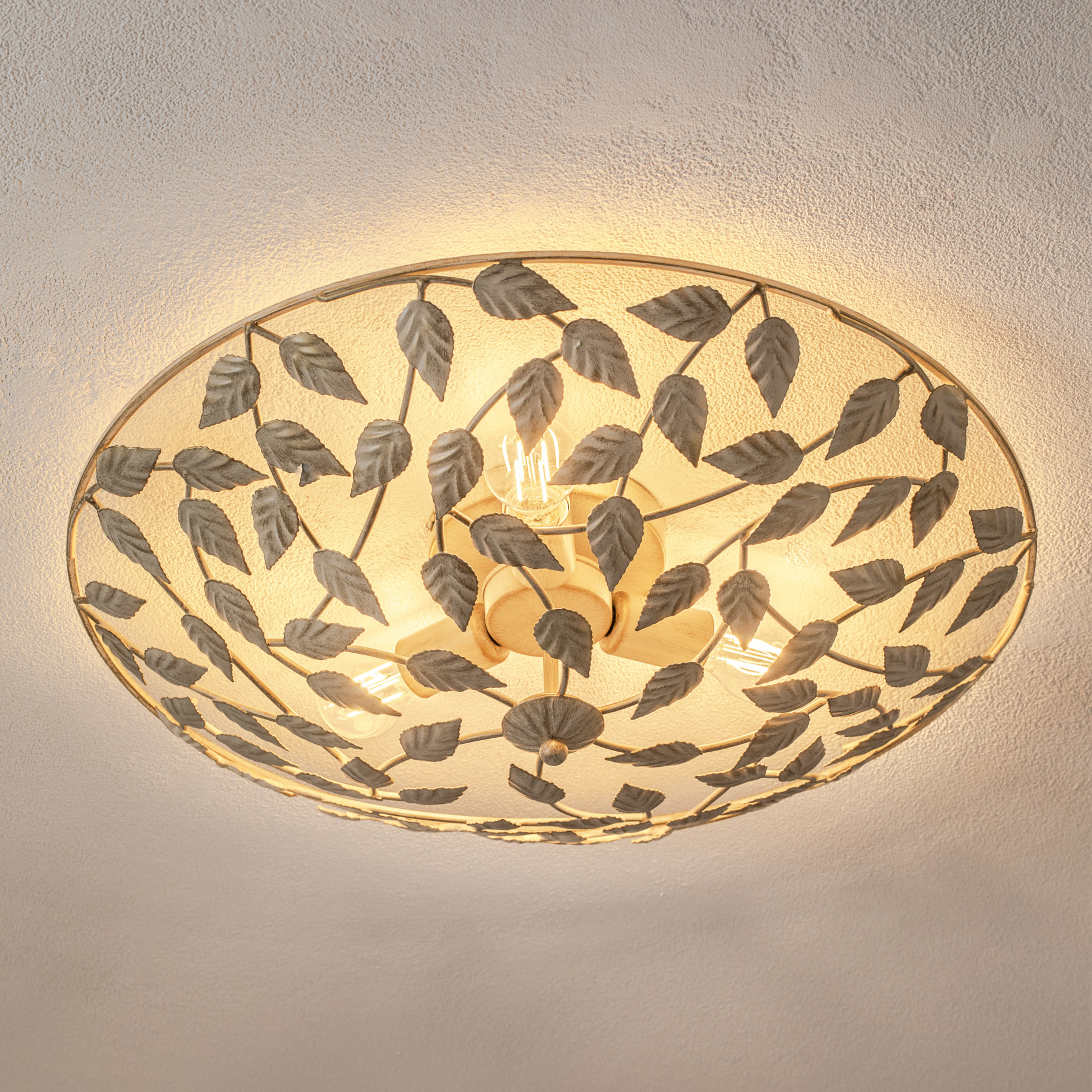 Plafoniera Arion, patinata crema/oro, Ø 63 cm, acciaio