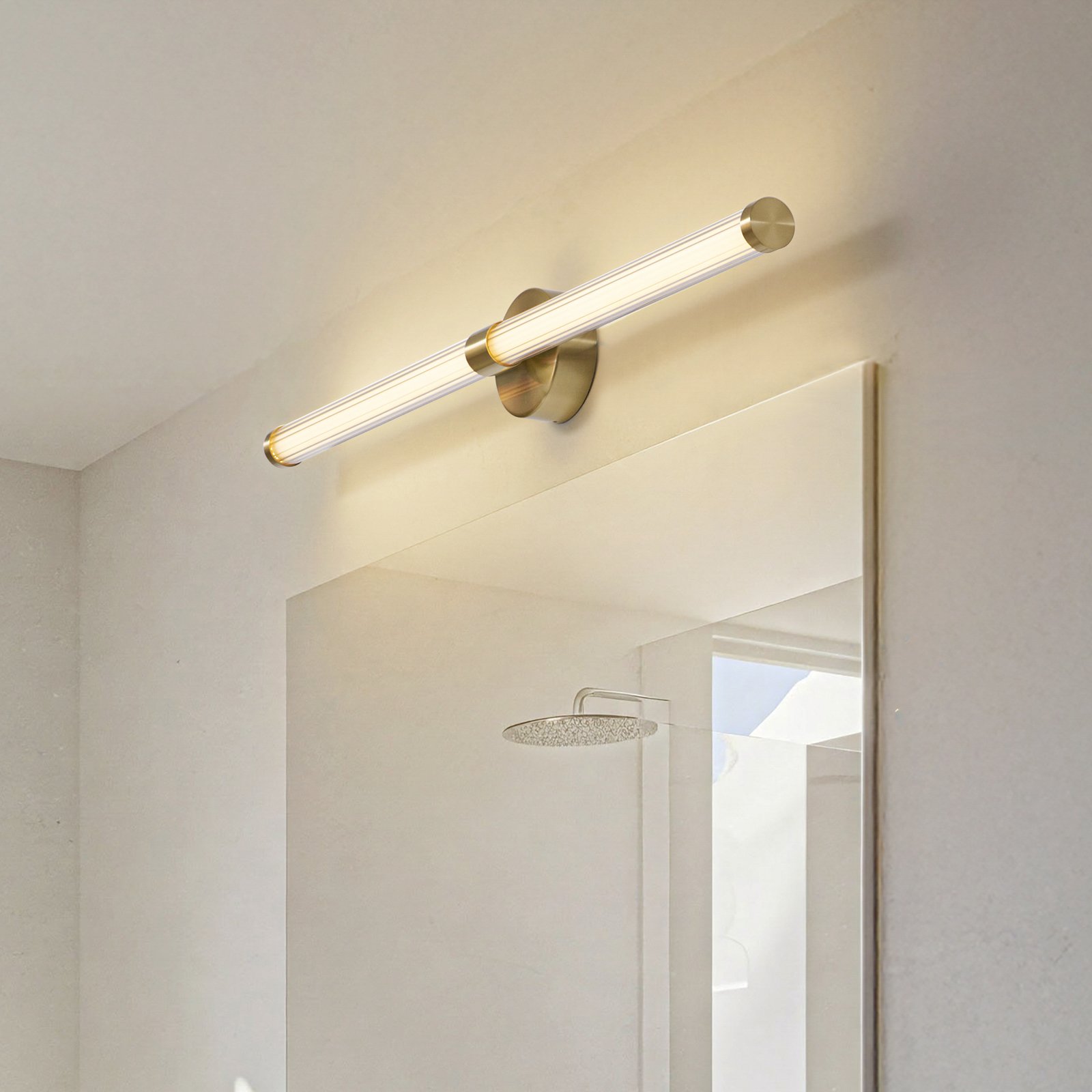 Lucande Melisa LED wall light, gold, 90 cm, CCT, IP44