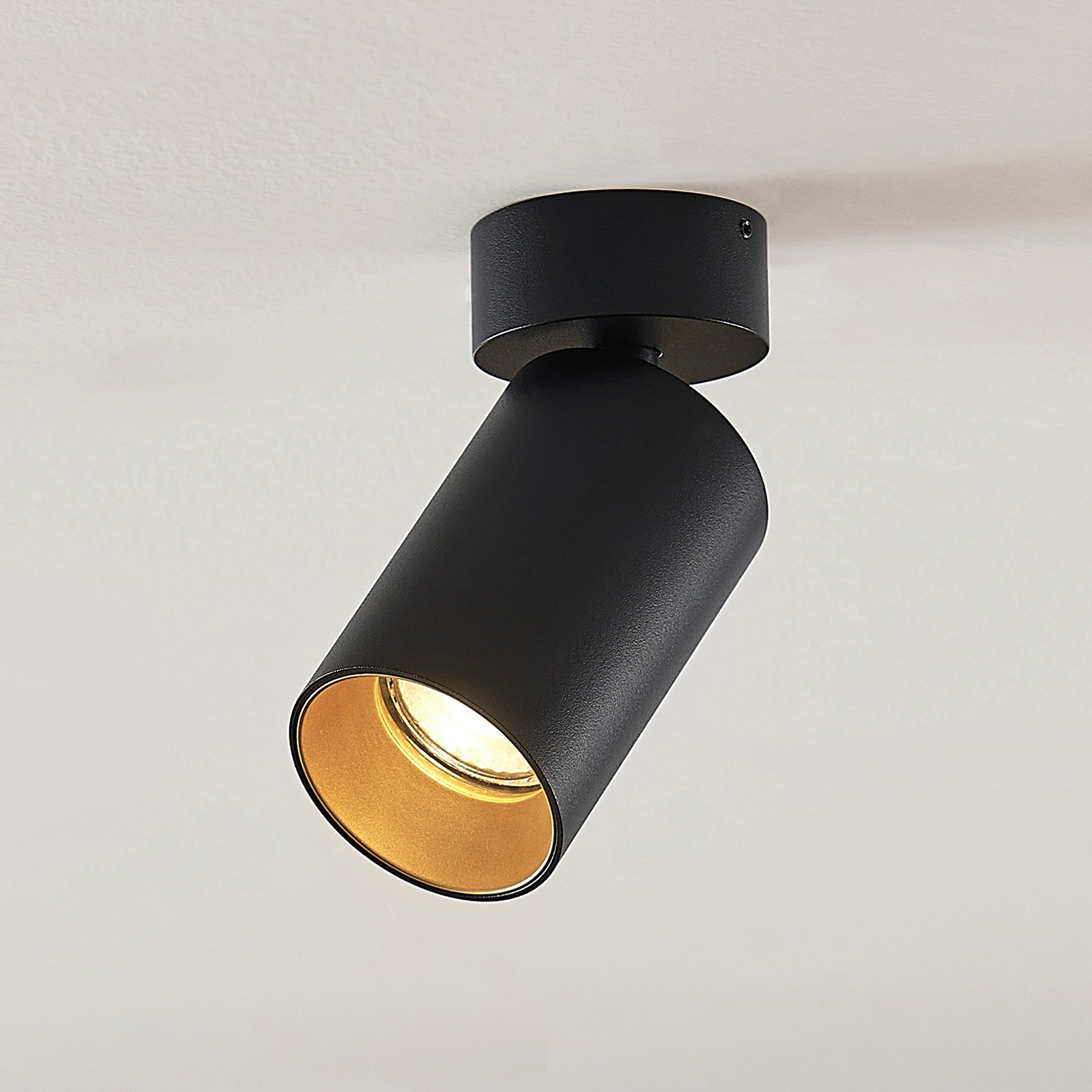 Arcchio Brinja spotlight, round, black/gold, 1-bulb