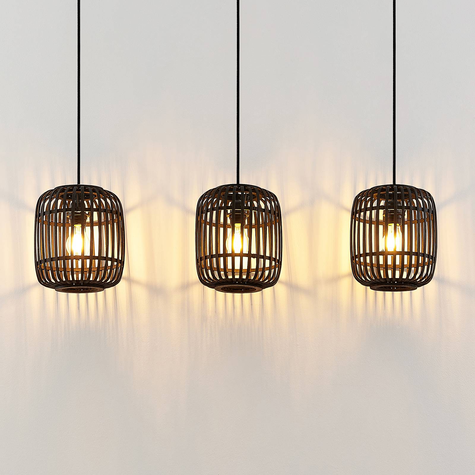 Lampa wisząca Lindby Canyana, czarna, 3-punktowa, rattan, 105 cm