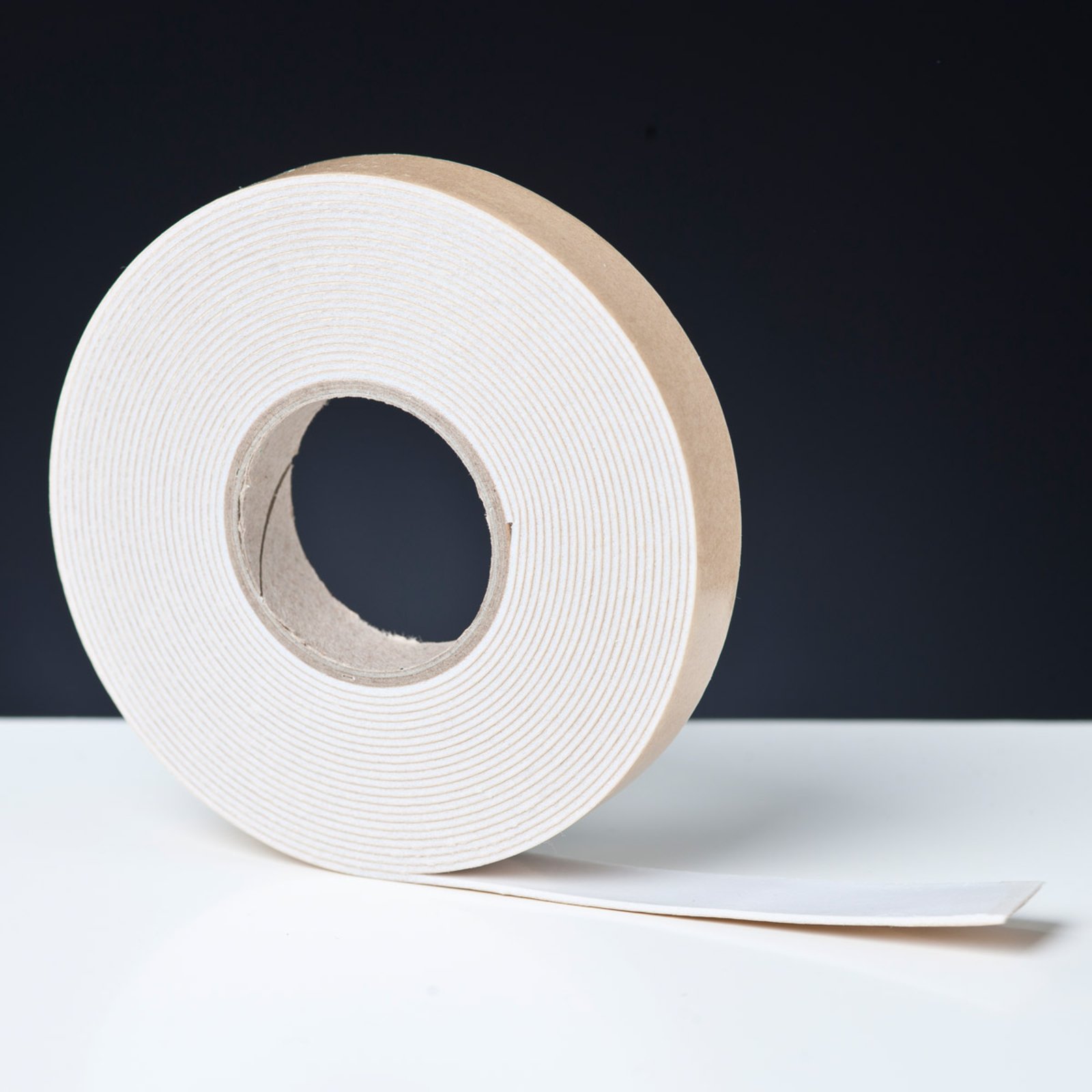 Adhesive strip for mirrors