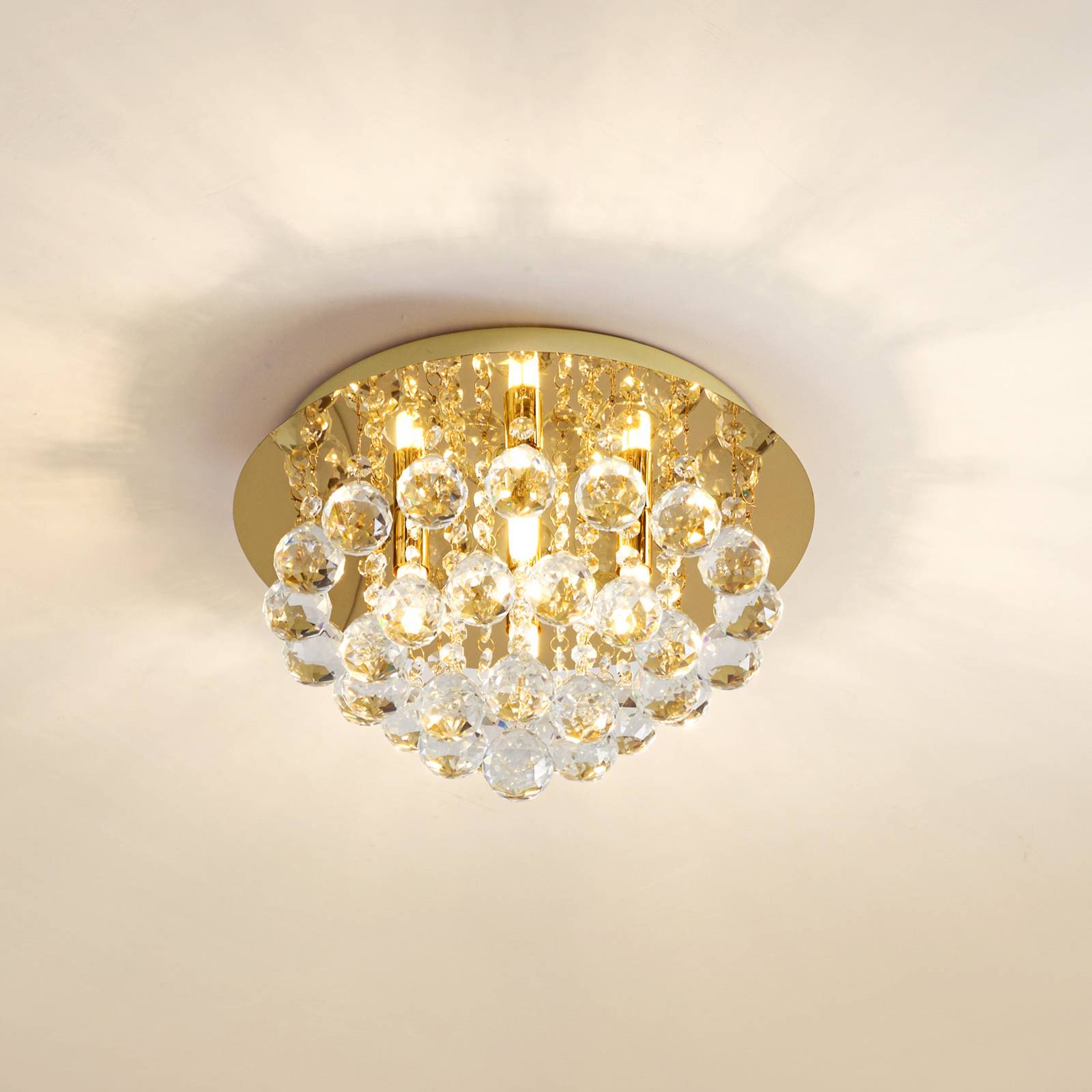 Lindby Deckenleuchte Gillion, 4-flg., gold, Kristall, Ø 35cm günstig online kaufen