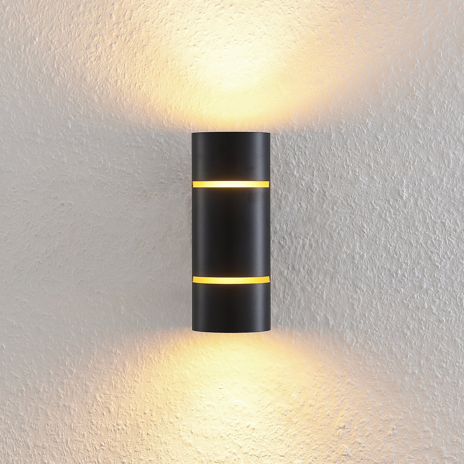 Lindby Deora LED-vägglampa, rund, svart-koppar