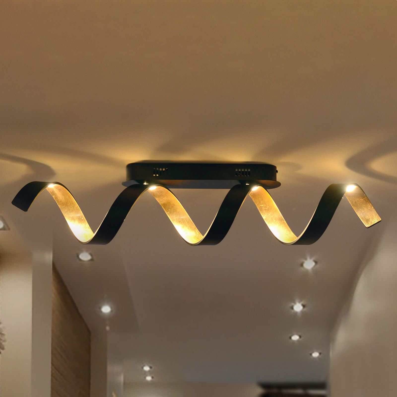 Helix LED ceiling light in black and gold