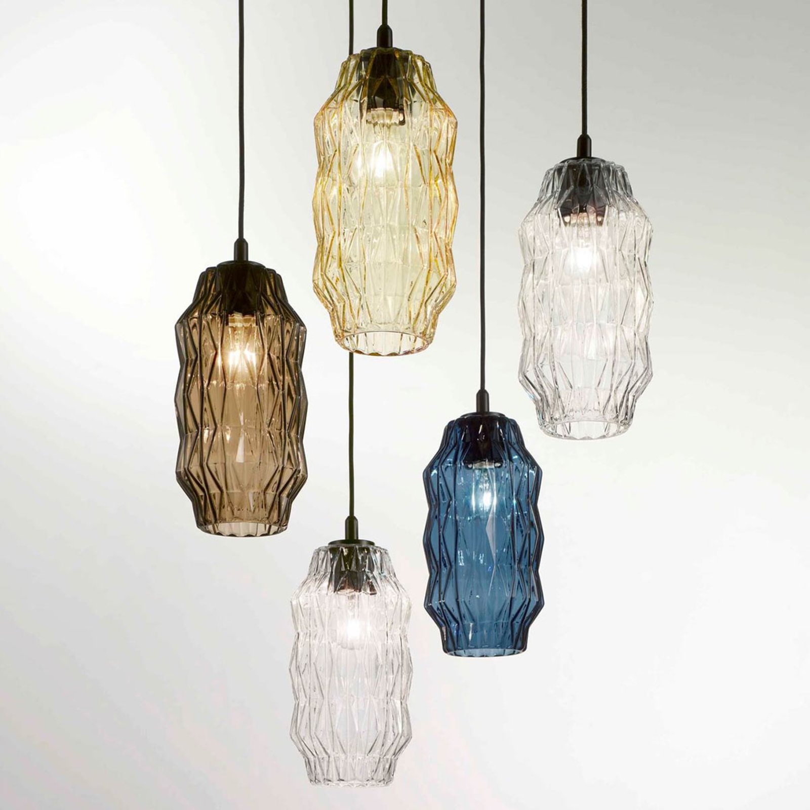 Origami pendant light made of glass, amber