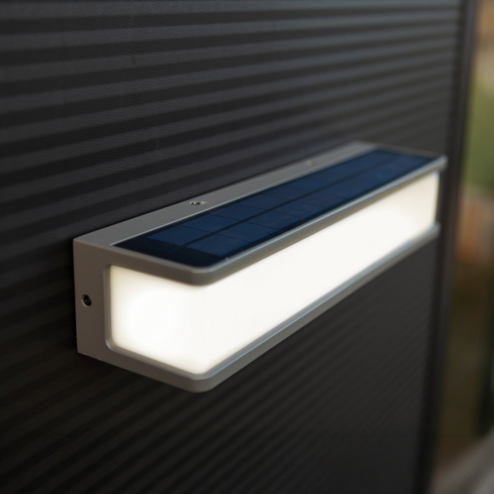 LED solar wall light Doblo with sensor, width 35cm