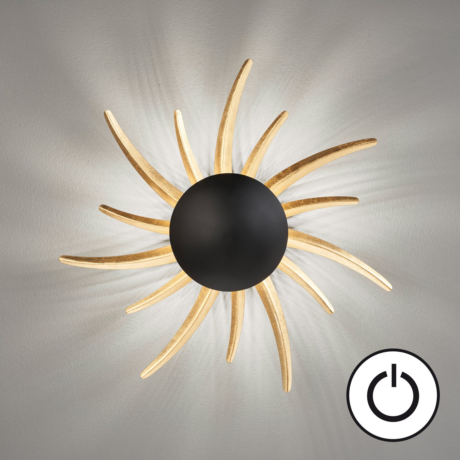 Sol LED wall light, black with golden rays