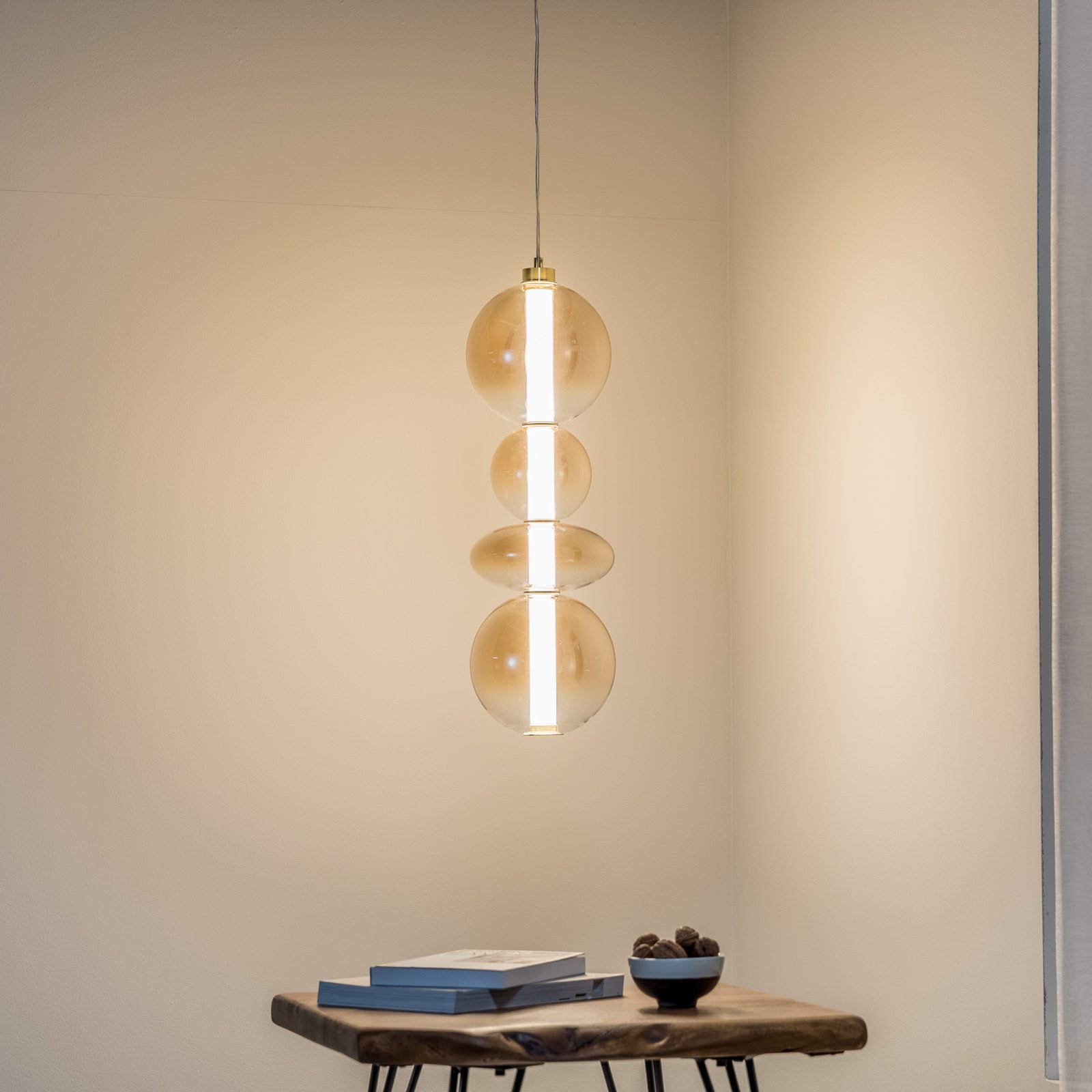 LED pendant light Daphne, amber-transparent glass, height 62 cm