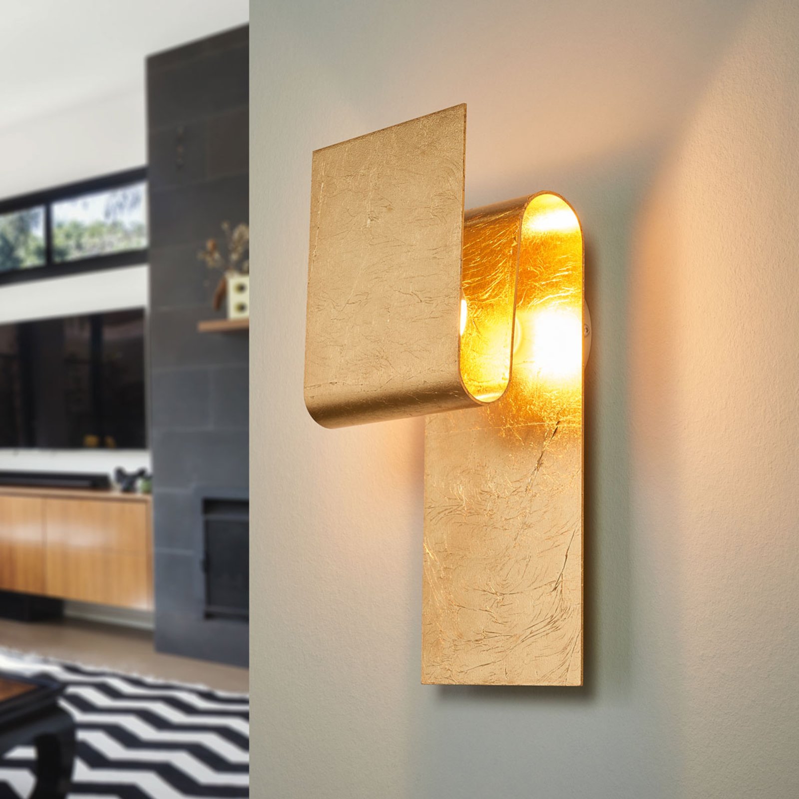 Escale Fold - a gold leaf covered wall lamp