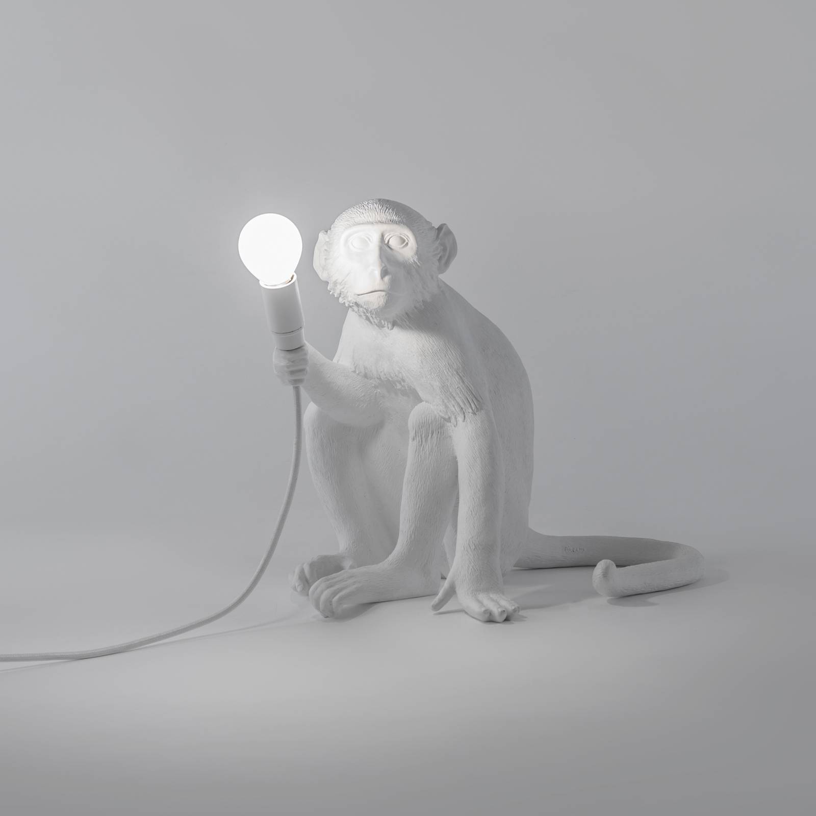 Lampa tarasowa LED Monkey Lamp, biała, siedząca