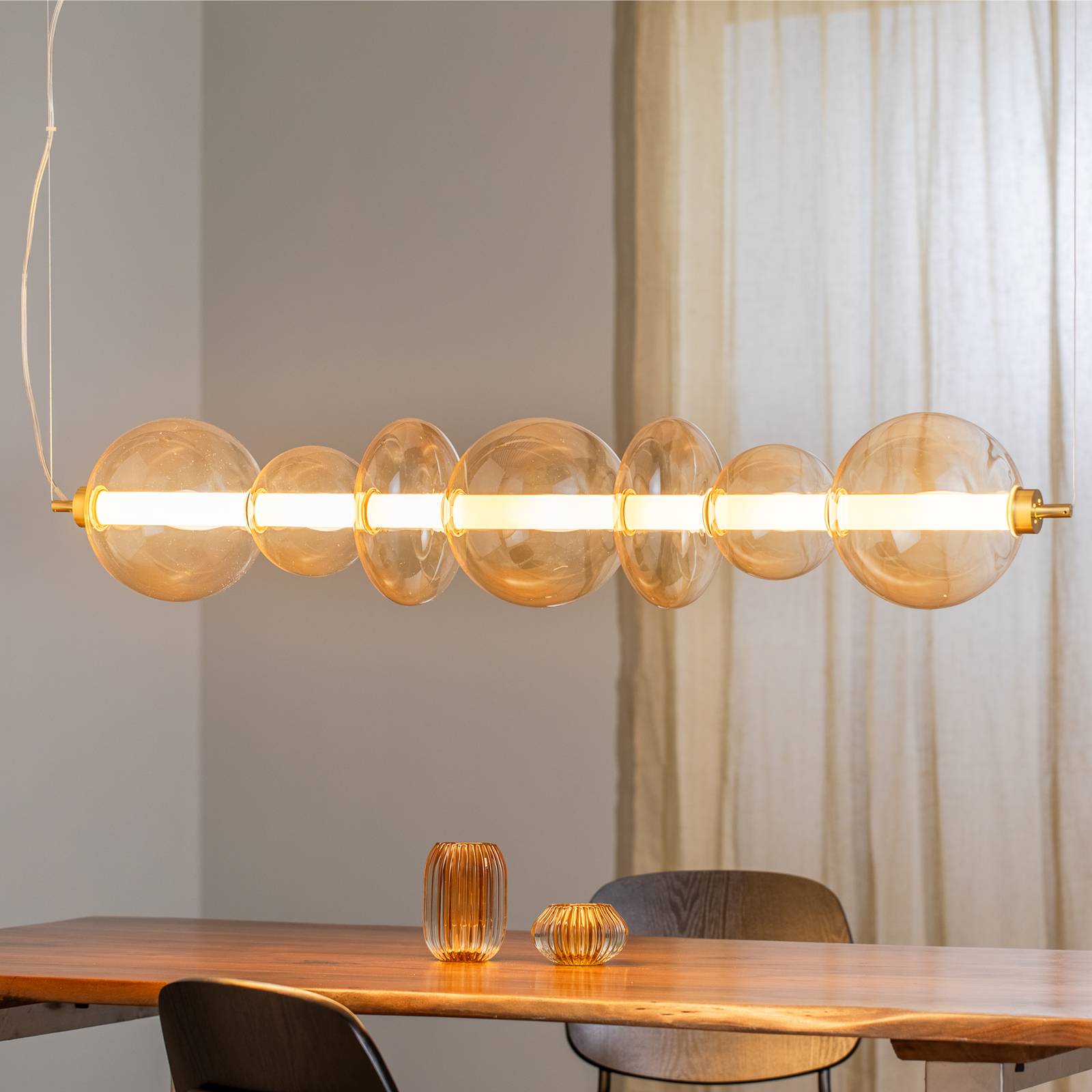 Lampa wisząca LED Daphne, bursztynowo-przezroczyste szkło, długość 118 cm